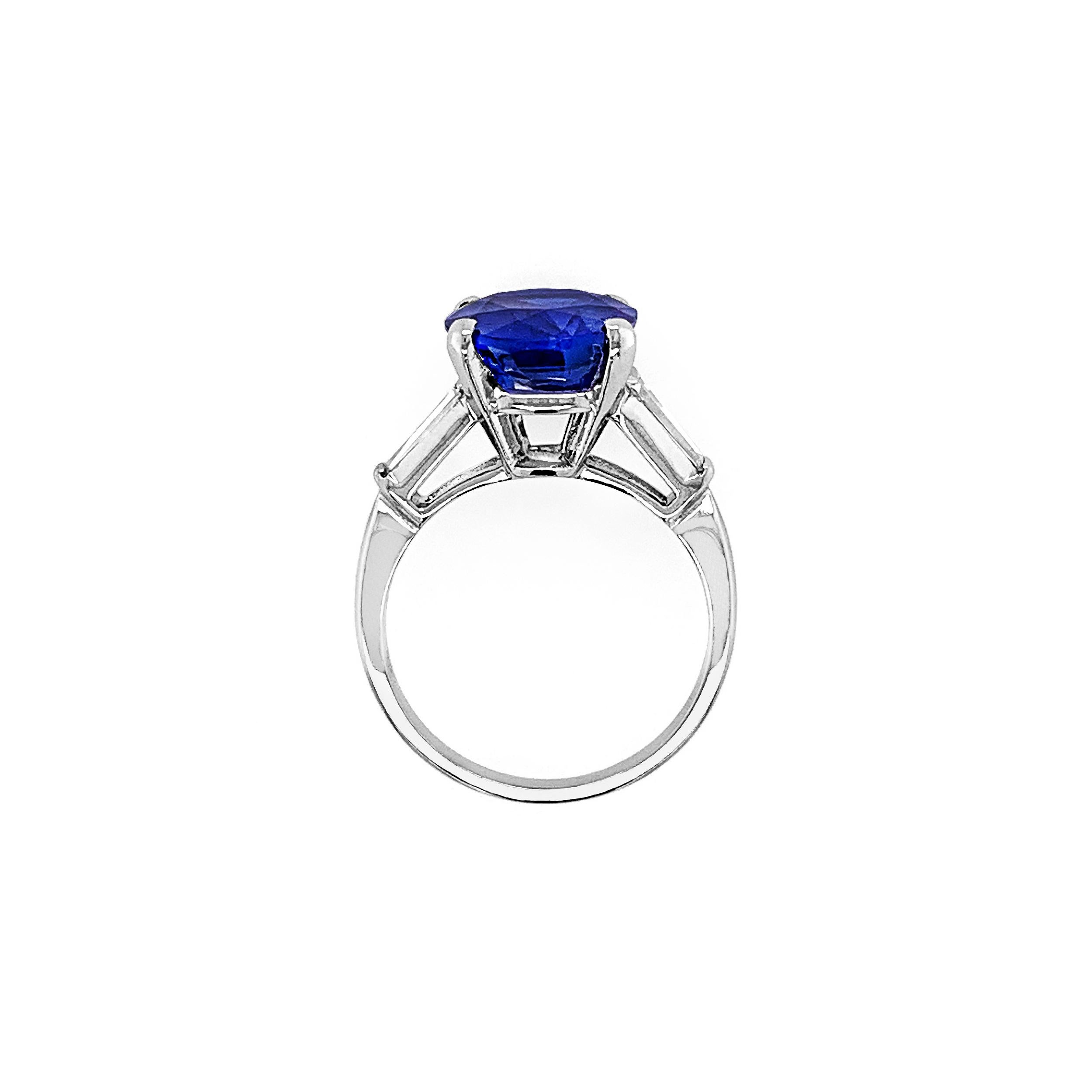 6.04 Carat Oval Sapphire with 0.56 Carat (total weight) Trapeze Side Diamonds in Platinum.