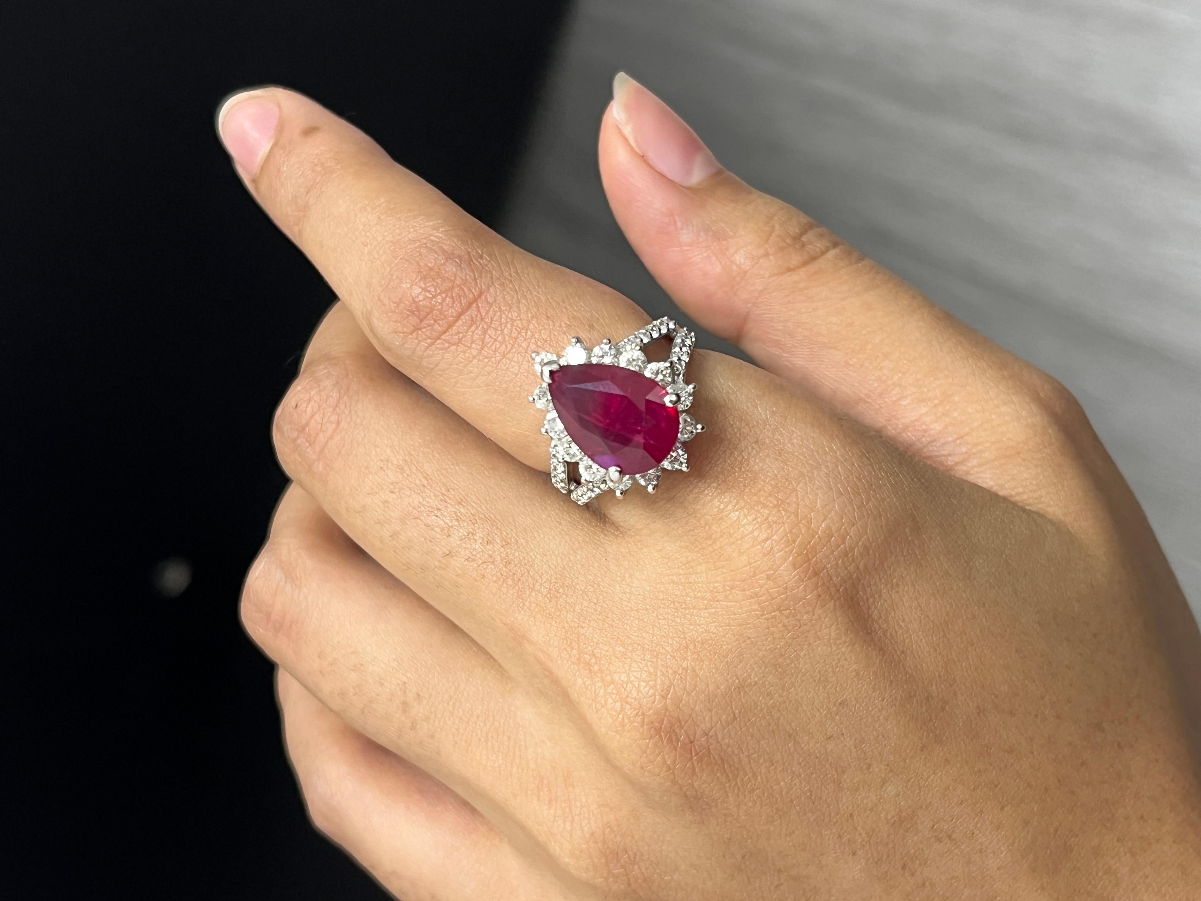 Indulge in the allure of exquisite jewelry with this captivating Ruby ring, a treasure that will leave all vintage jewelry enthusiasts and ruby lovers delighted. 

This magnificent ring showcases a breathtaking centerpiece—a 6.04 Carat pear-cut