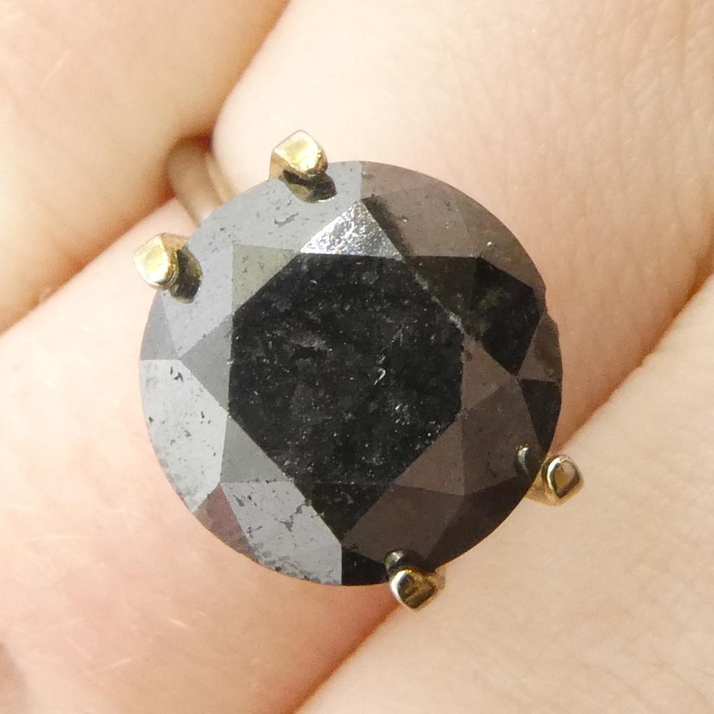 Description:

Gem Type: Diamond 
Number of Stones: 1
Weight: 6.04 cts
Measurements: 11.15 x 11.15 x 7.36 mm
Shape: Round
Cutting Style Crown: Brilliant Cut
Cutting Style Pavilion: Brilliant Cut 
Transparency: Opaque
Clarity: N/A
Colour: Black
Hue: