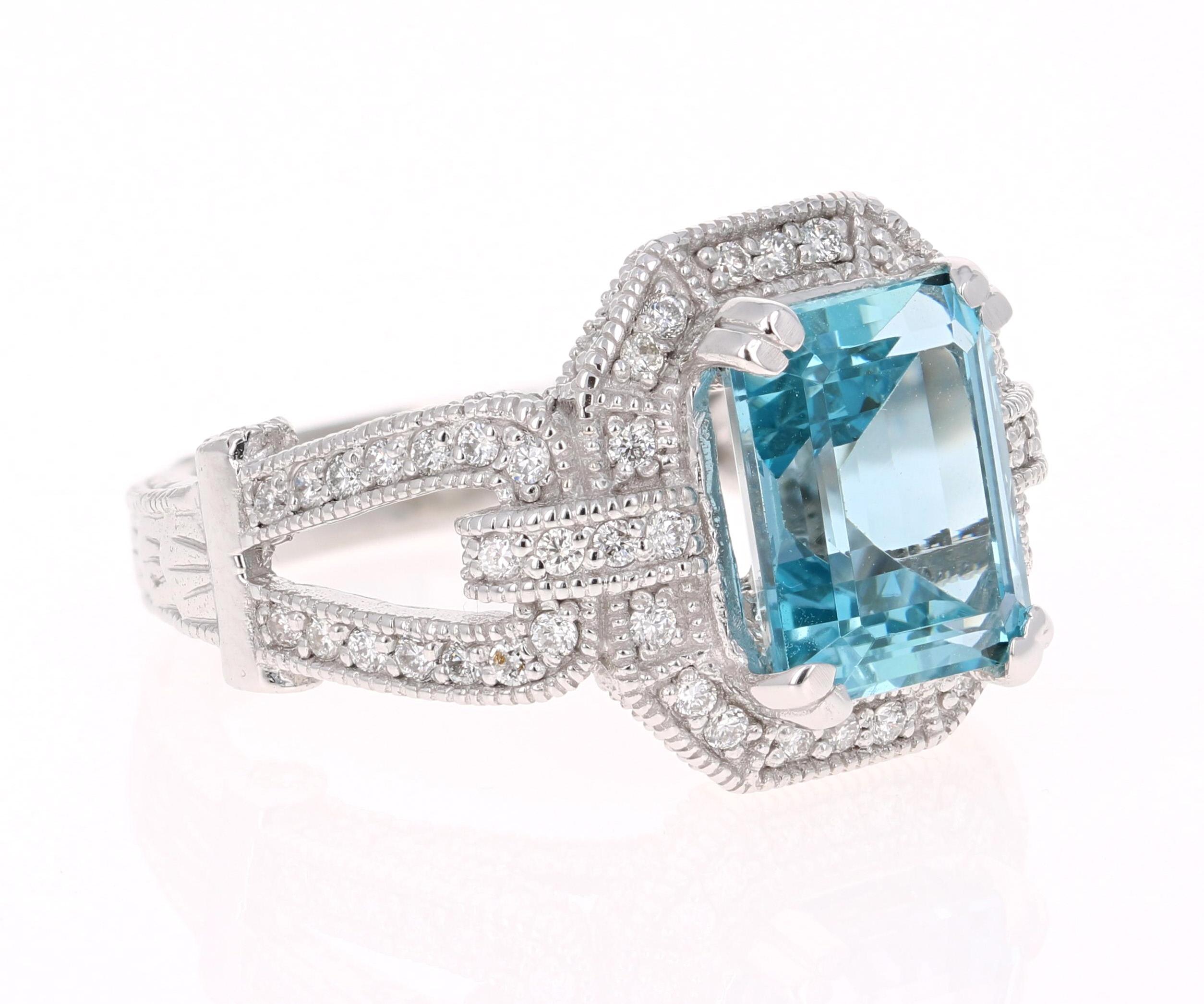This ring has a beautiful 4.78 Carat Emerald Cut Aquamarine set in the center of the ring and is surrounded by Natural Round Cut Diamonds that weigh 1.27 carat (Clarity: VS2, Color: F). The total carat weight of this ring is 6.05 carats. 
The
