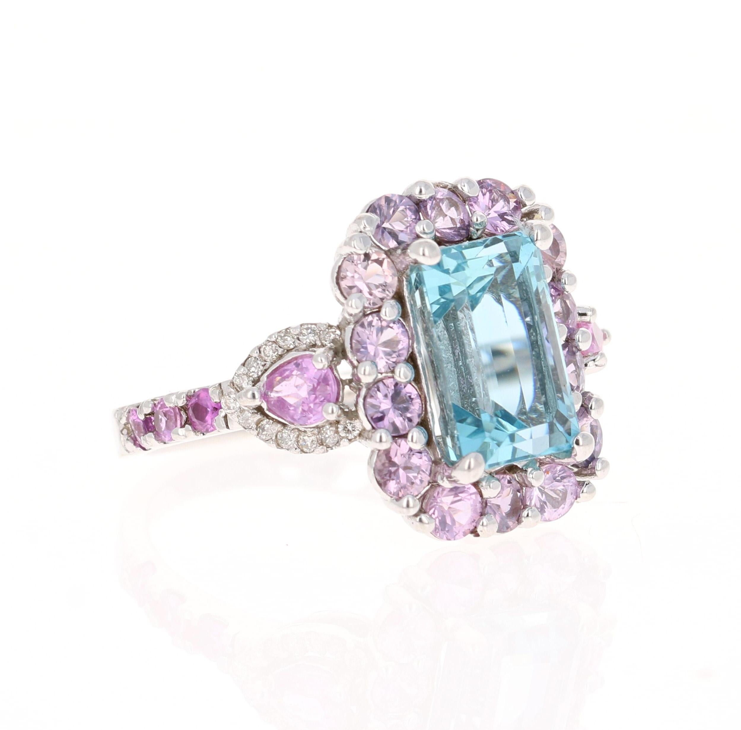 This ring has a gorgeous 3.60 Carat Emerald Cut Aquamarine and is surrounded by Pear Cut Pink Sapphires  that weigh 0.43 Carats. Also an additional 20 Pink Sapphires that weigh 1.90 carats. It is further embellished with 26 Round Cut Diamonds that