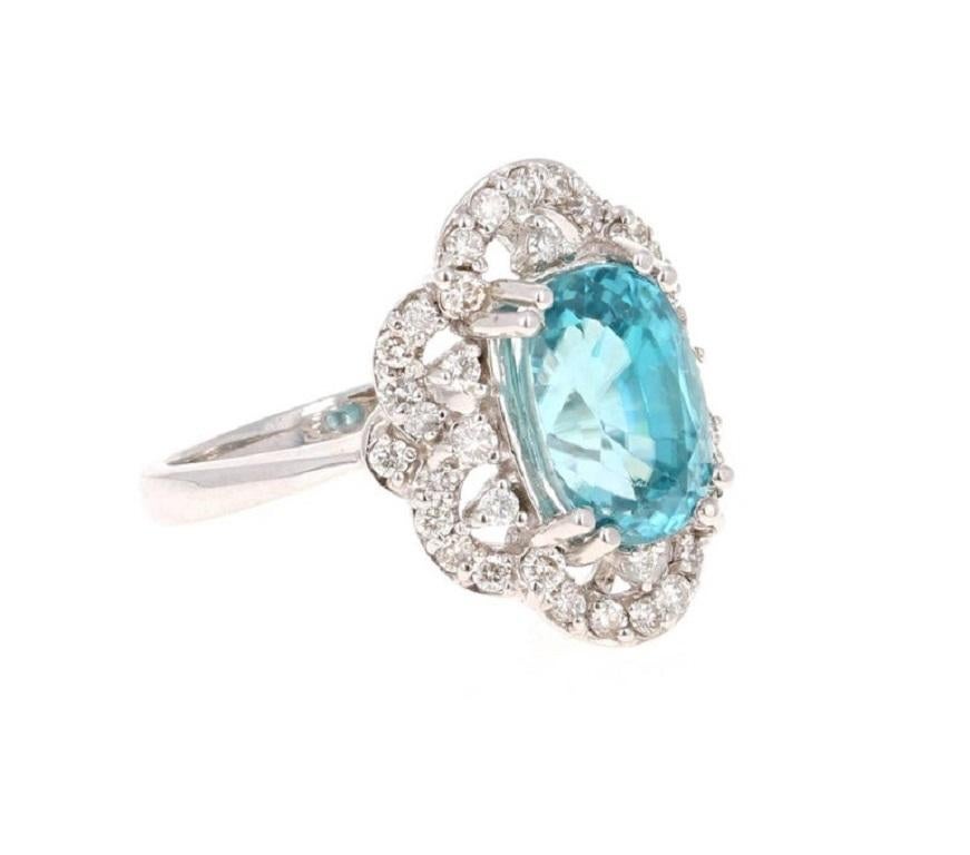 Dazzling Blue Zircon and Diamond Ring! Blue Zircon is a natural stone mined in different parts of the world, mainly Sri Lanka, Myanmar, and Australia.

This Oval Cut Blue Zircon is 5.49 carats surrounded by 40 Round Cut Diamonds that weigh 0.56