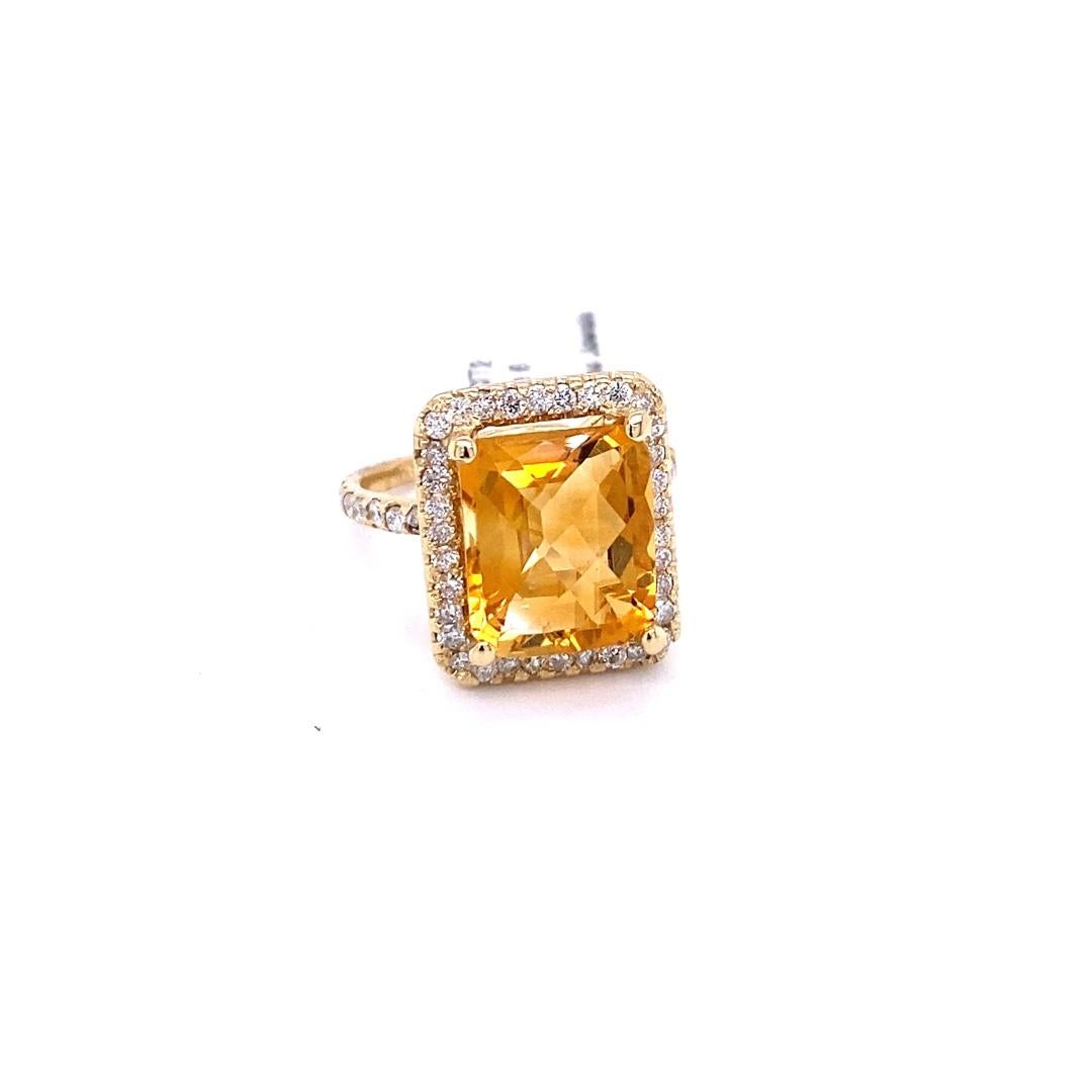 A Stunning beauty to say the least! 

This magnificent ring has a bold Emerald Cut Citrine that is blazing yellow! It weighs 5.25 Carats and is surrounded by a beautiful halo of 56 Round Cut Diamonds that weigh 0.80 Carats. (Clarity: SI, Color: F)