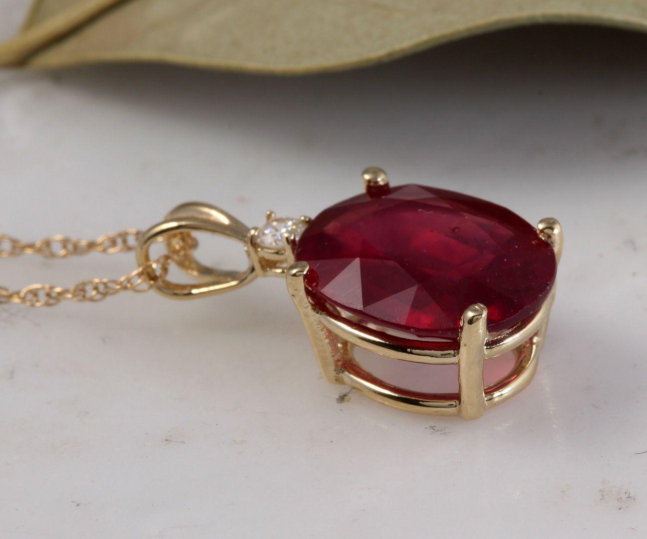 6.05Ct Natural Red Ruby and Diamond 14K Solid Yellow Gold Necklace

Amazing looking piece!

Stamped: 14K

Natural Oval Cut Ruby Weights: 6.00 Carats

Ruby Measures: 12 x 10mm

Total Natural Round Diamond weights: 0.05 Carats (H / SI1)

Total Chain