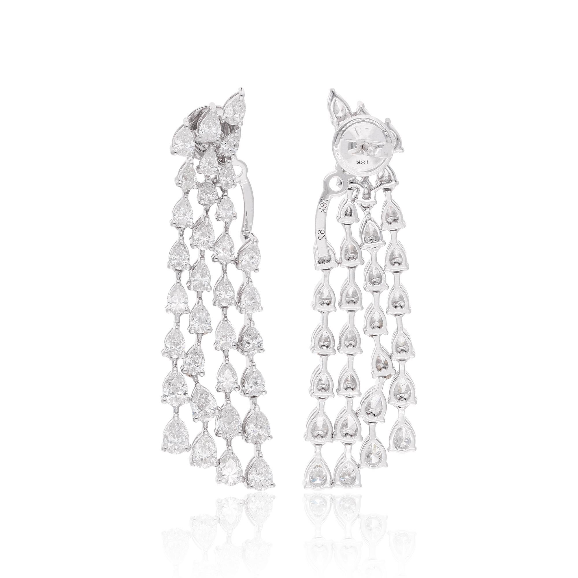 It sounds like you're describing a pair of diamond jacket earrings made from 18 karat white gold, featuring pear-shaped diamonds with a total weight of 6.05 carats. This type of jewelry is considered fine jewelry due to the high-quality materials