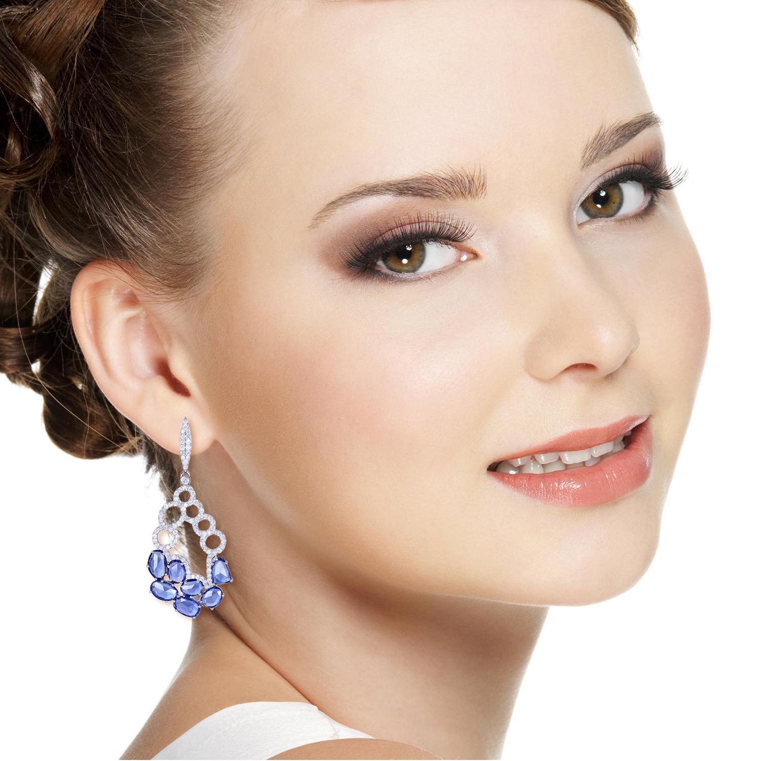 Handcrafted from 18-karat gold, this stunning drop earrings is set with 6.05 carats Sapphire and 1.29 carats of glimmering diamonds. 

FOLLOW  MEGHNA JEWELS storefront to view the latest collection & exclusive pieces.  Meghna Jewels is proudly rated