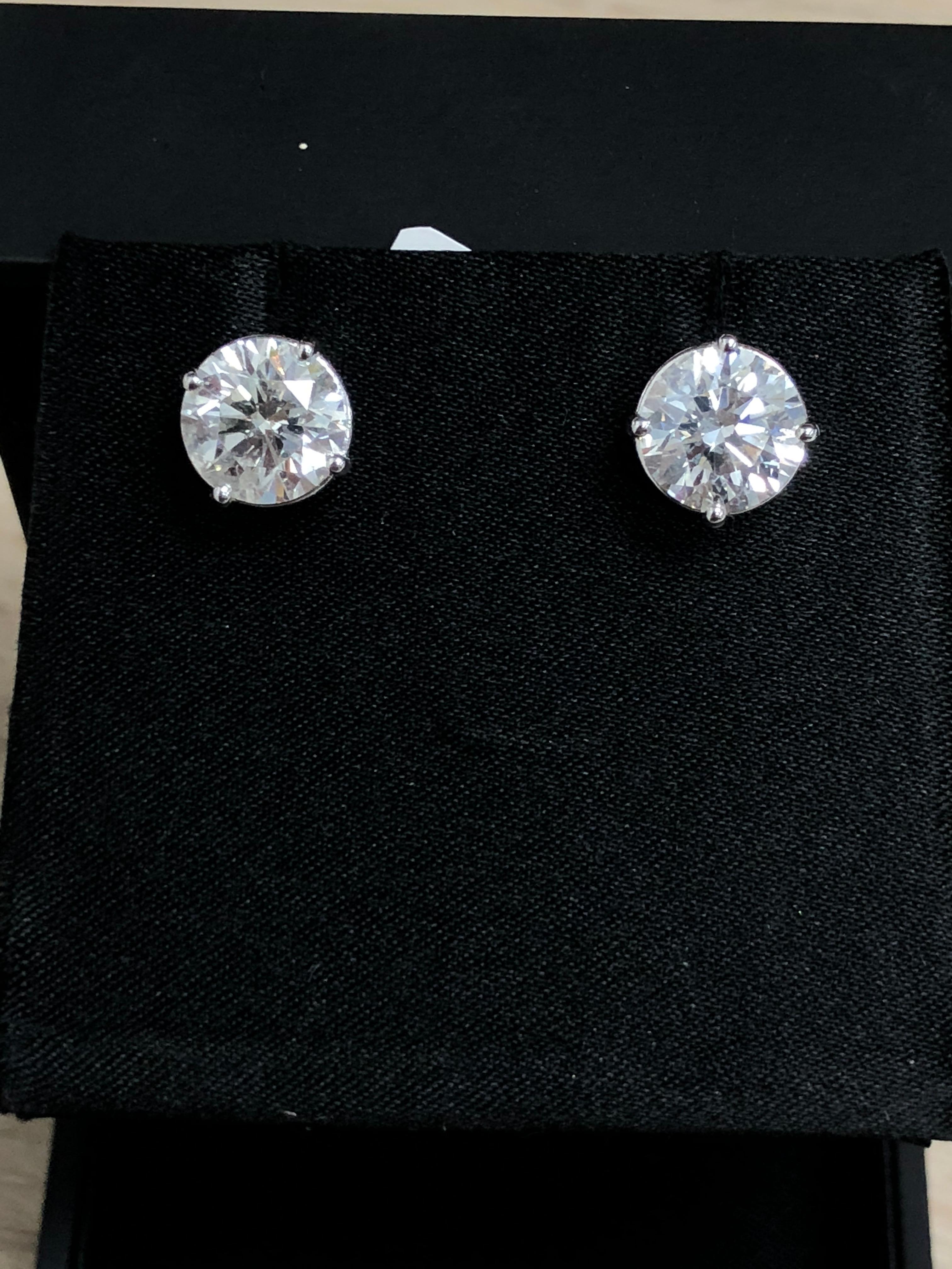 18K White gold Diamond stud earrings, set in a four prong mouting
The total diamond weight is 6.05 Carats. Ideal cut diamonds 
Near colorless white slightly included. 100% eye clean (H-I SI)
Certified by AAA Gemological appraisal laboratory 

