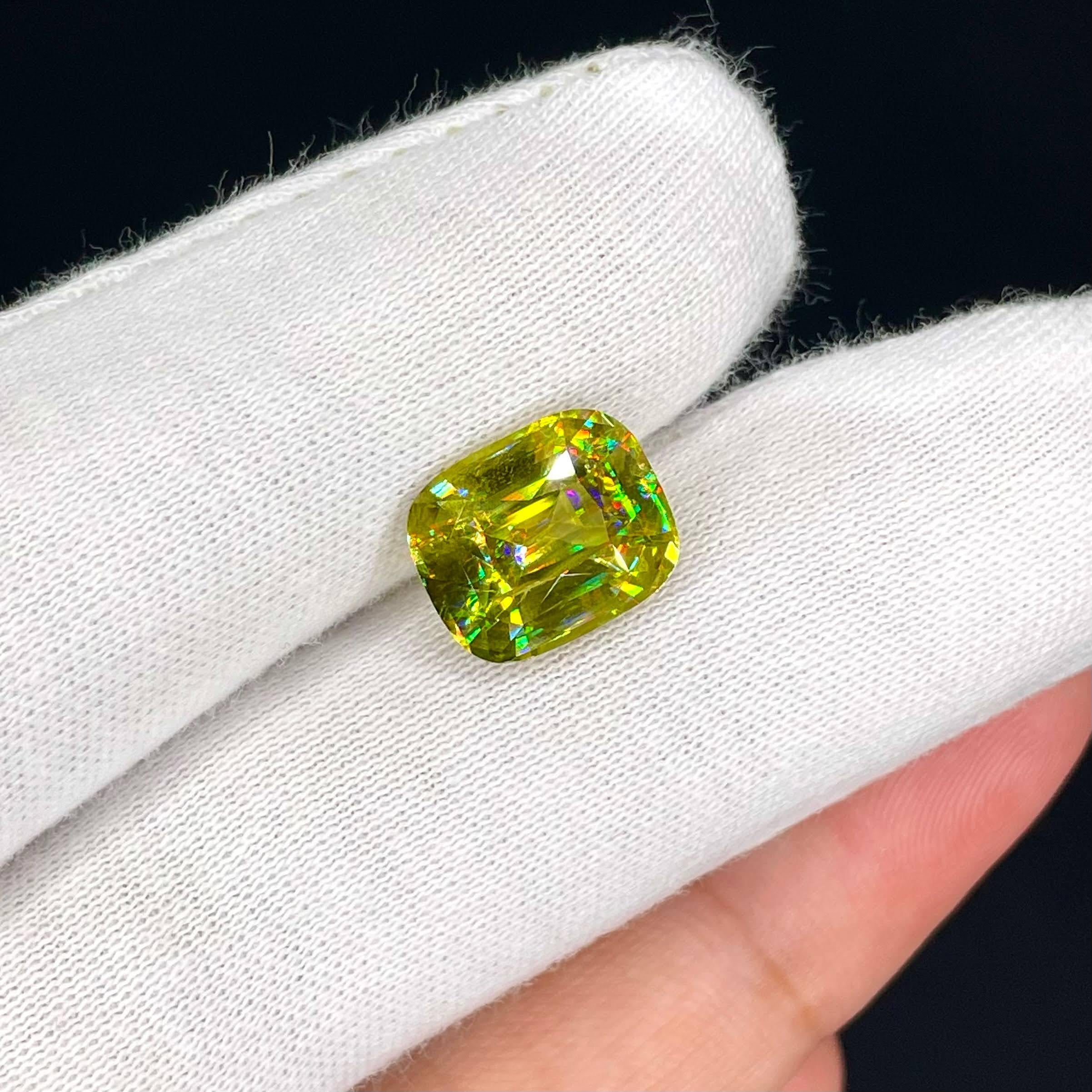 Weight 6.05 carats 
Dimensions 12.1x10.0x6.4 mm 
Treatment none 
Origin Madagascar 
Clarity SI
Shape cushion 
Cut fancy cushion 



The exquisite beauty of a 6.05 carat Green Sphene stone unfolds in this fine example of a gem from Madagascar.
