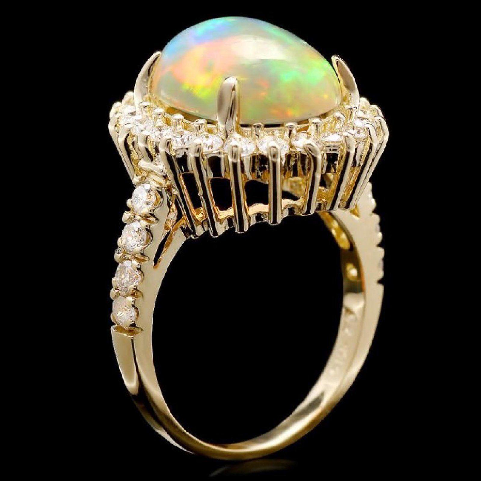 6.05 Carats Natural Impressive Ethiopian Opal and Diamond 14K Solid Yellow Gold Ring

The opal has beautiful fire, pictures don't show the whole beauty of the opal!

Total Natural Opal Weight is: Approx. 5.00 Carats

Opal Measures: 14.00x
