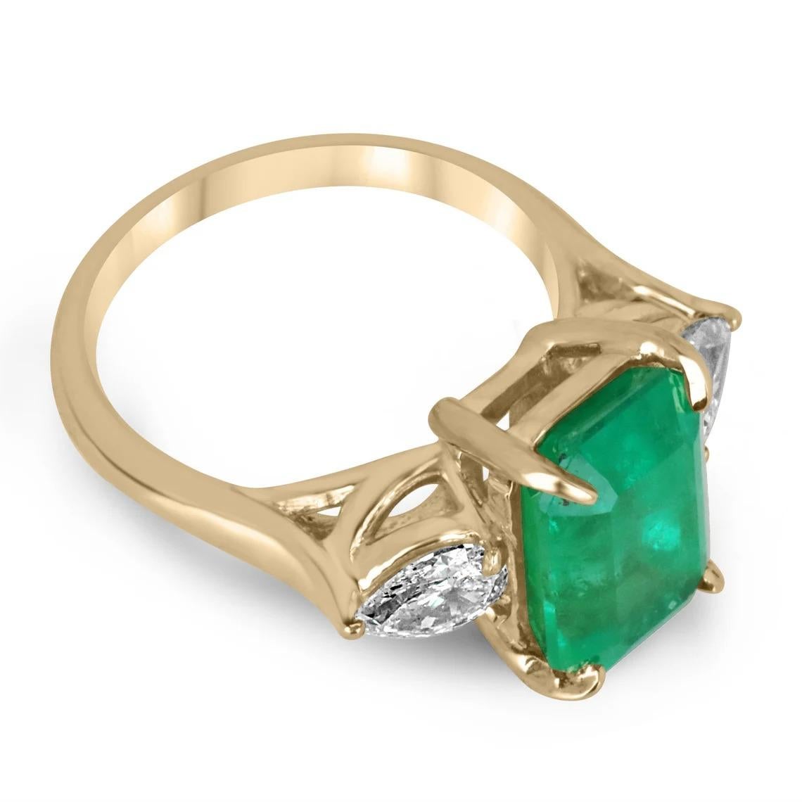 A classic Colombian emerald and diamond engagement, statement, or right-hand ring. Dexterously crafted in 18K gold this ring features a 5.14-carat natural Colombian emerald, emerald cut from the famous Muzo mines. Set in a secure prong setting, this
