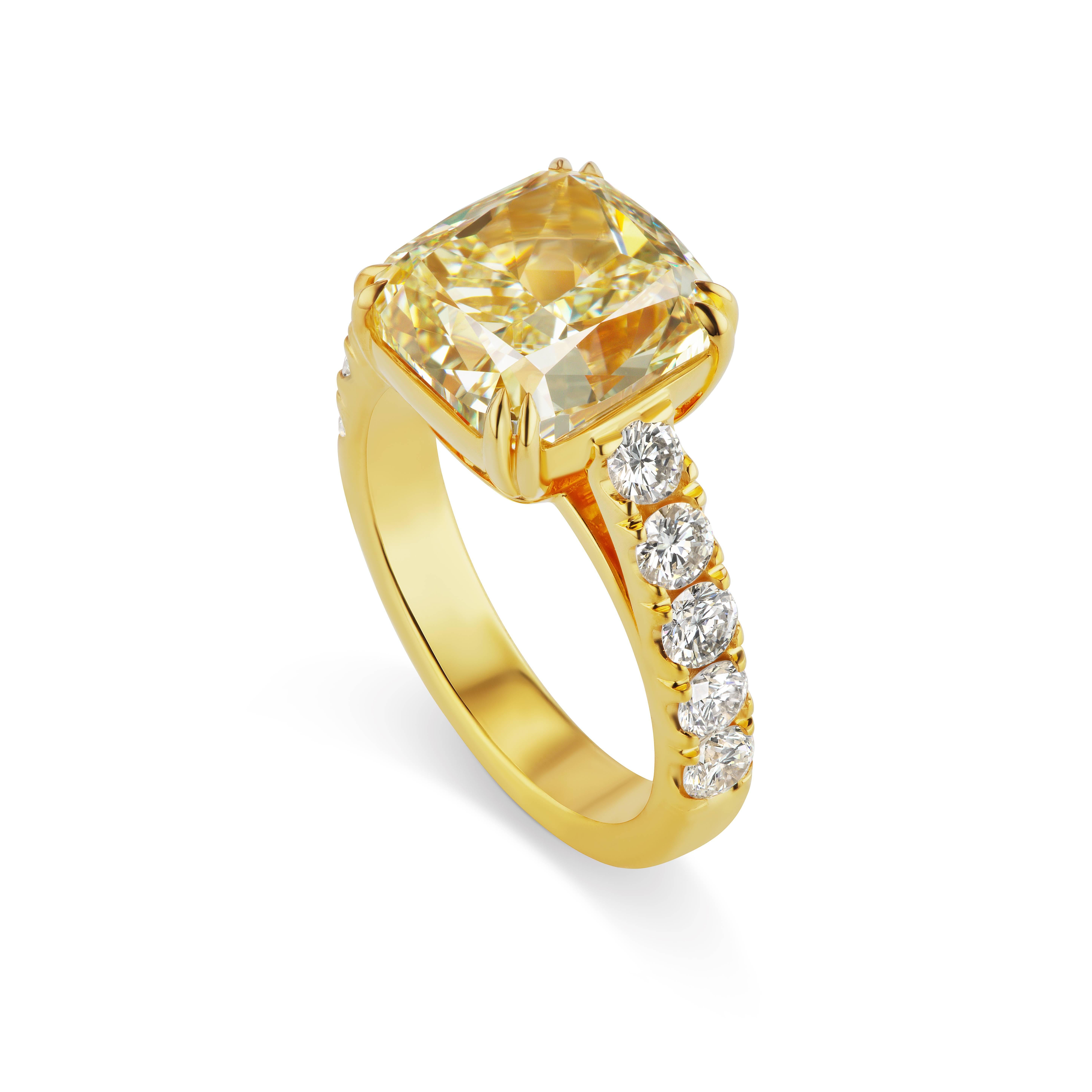 This Scarselli 6.06 carat  Fancy Light Yellow Radiant cut diamond is VS2 clarity and is beautifully set with 5 white diamonds on each side in 18 karat Yellow Gold.    For any other Scarselli 1st Dibs inventory of spectacular fancy color diamonds and