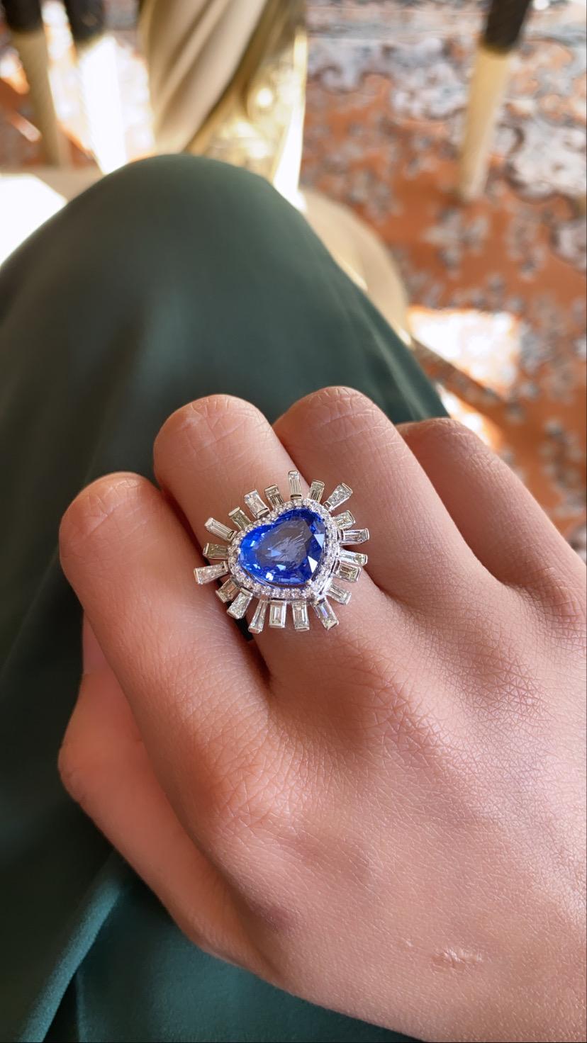 A beautiful and gorgeous heart shape blue sapphire set in 18k white gold with diamonds. The blue sapphire originates from ceylon and weight is 6.06 carats , the natural diamond weight is 1.79 carats. The net gold weight is 7.34 grams and ring