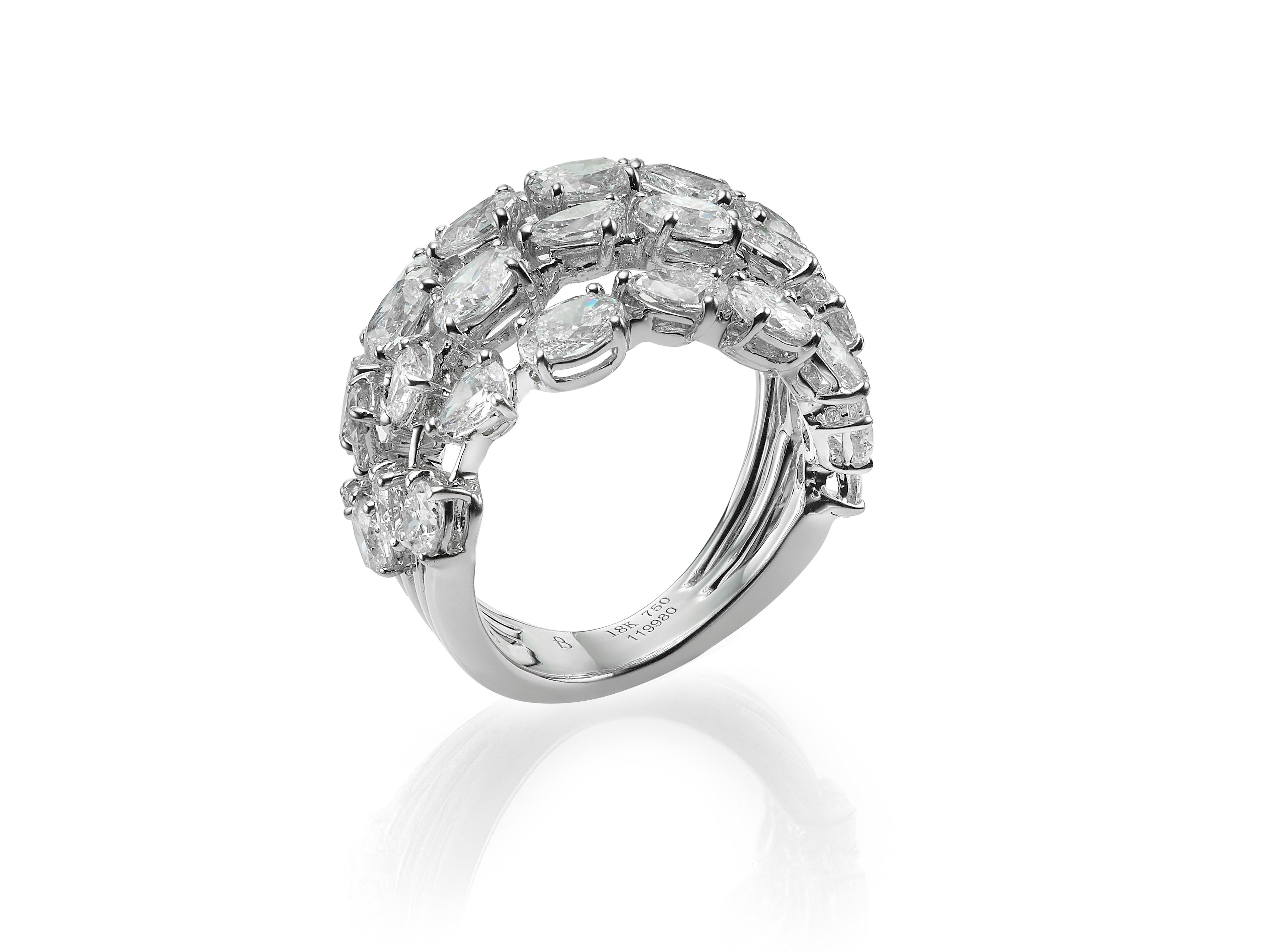 Handcrafted from 18K white gold, Butani's diamond bombe cocktail ring features four lines of alternating oval-cut and pear-cut white diamonds totaling 6.06 carats.  Currently a ring size US 7.  For other sizes, please contact seller.

Composition: