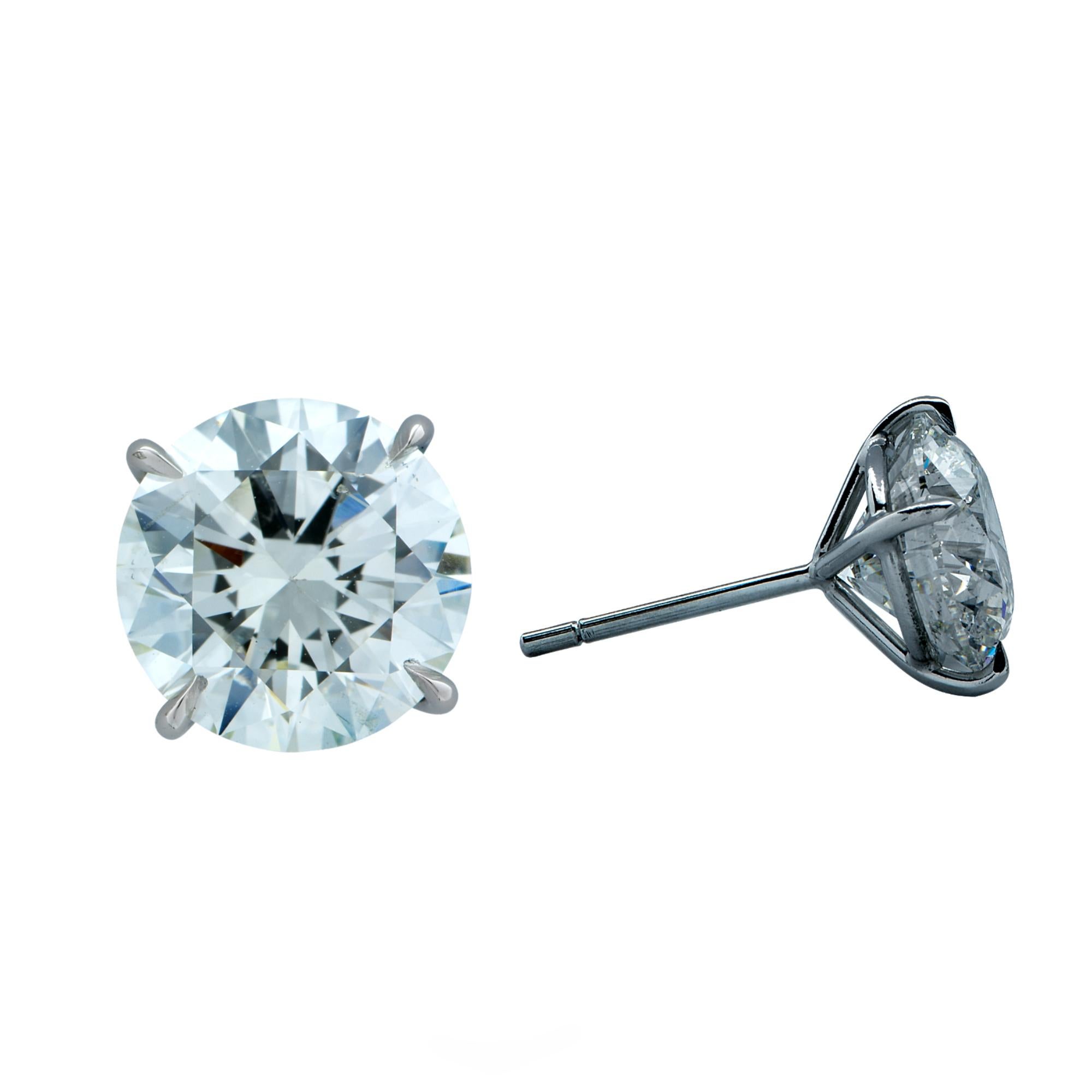 Stunning platinum hand-made solitaire stud earrings featuring two round brilliant cut diamonds weighing 6.12cts total, J color SI2 clarity GIA. Both diamond have excellent, polish, symmetry and cut grade.

Our pieces are all accompanied by an