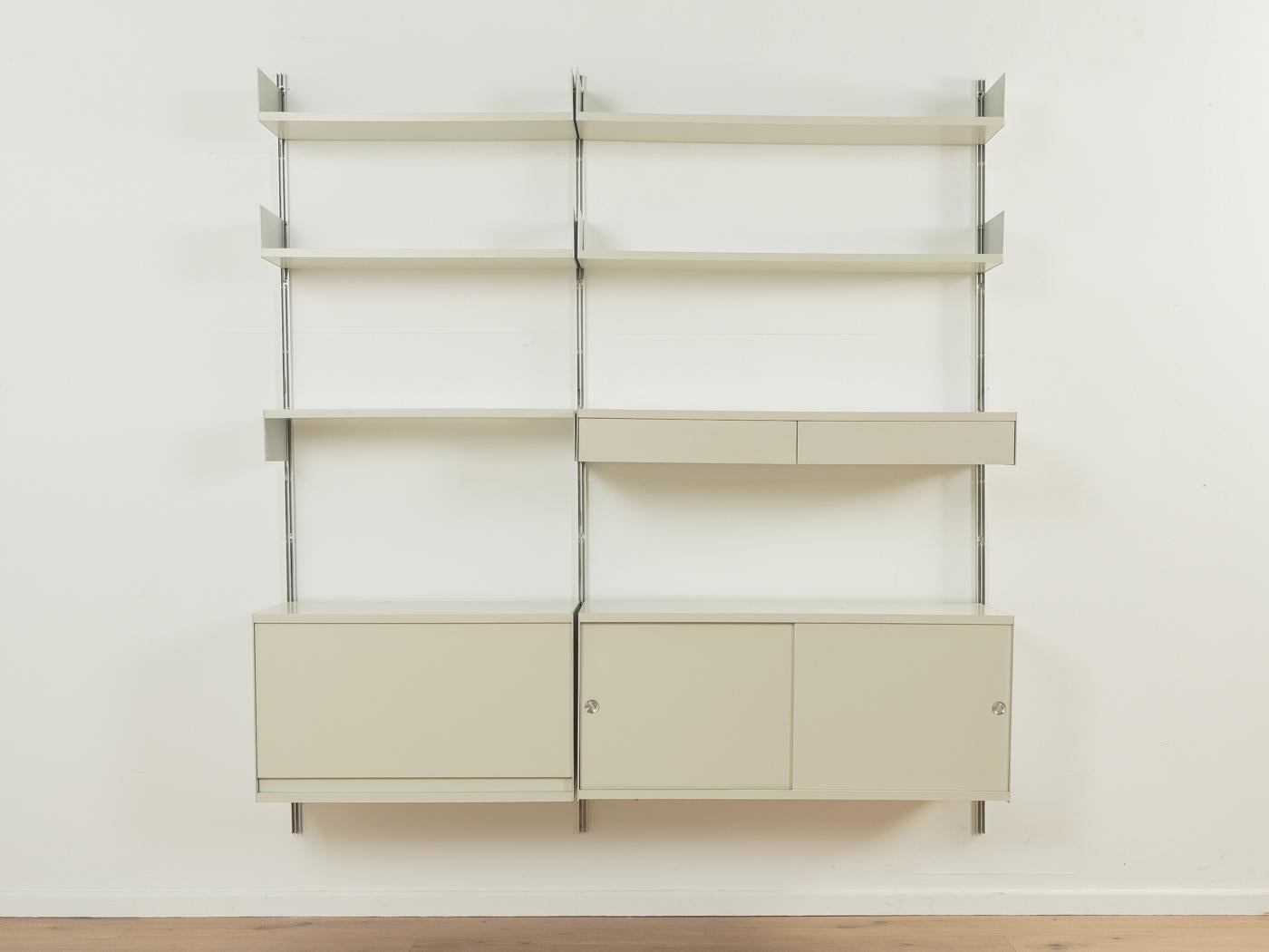 Modular 606 shelving system by Dieter Rams for Vitsœ from the 1960s. High-quality construction consisting of six aluminum E-Tracks, five shelves, one container with up and over door, one container with drawers and one container with sliding