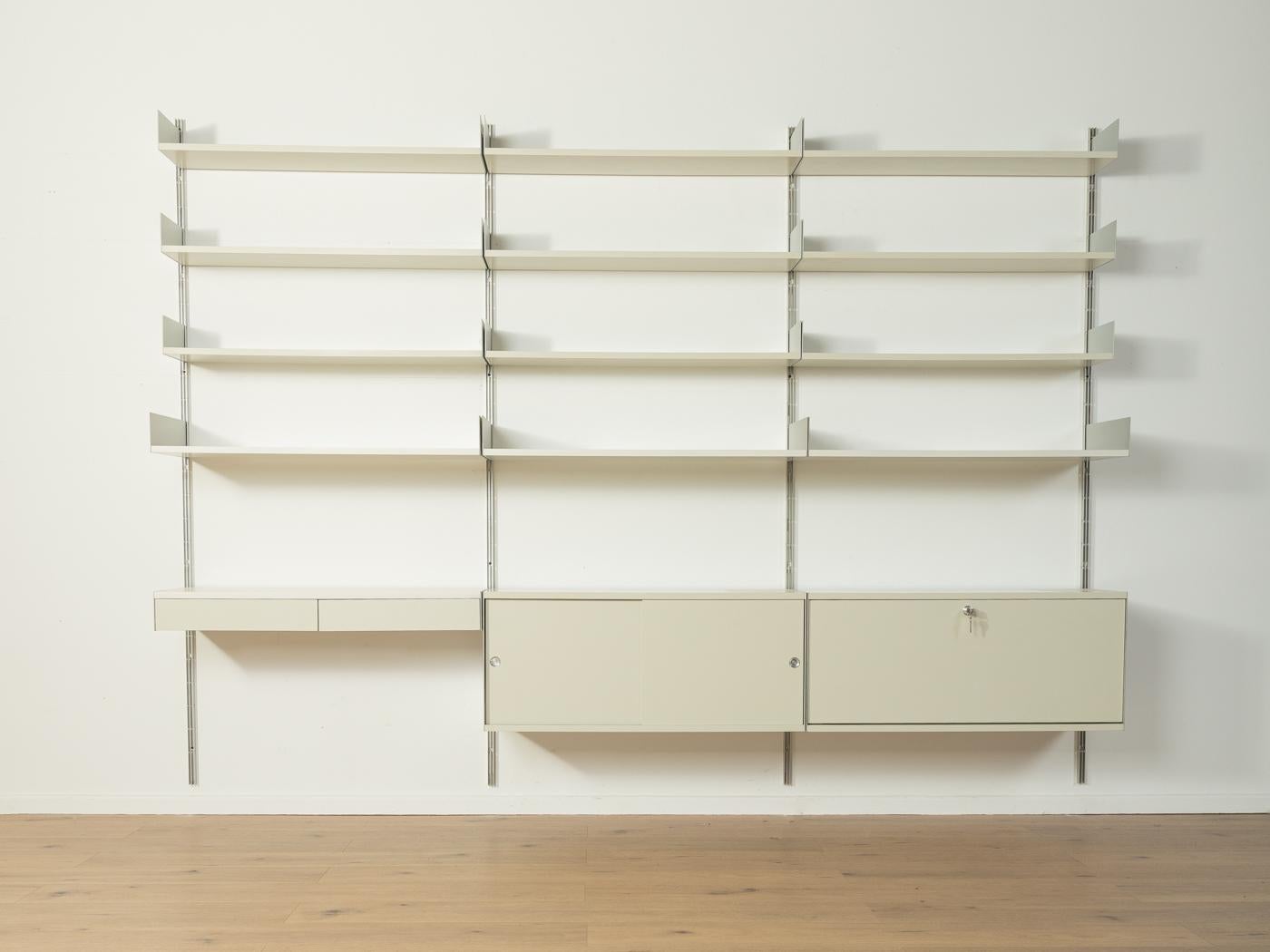 Modular 606 shelving system by Dieter Rams for Vitsœ from the 1960s.High-quality construction consisting of eight aluminium E profiles, 16 shelves, one container with two sliding doors, one container with a lockable hinged doord and one container