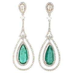 6.06ct pear Shaped Emerald Dangle Earrings Encircled In Diamonds In 18k Gold