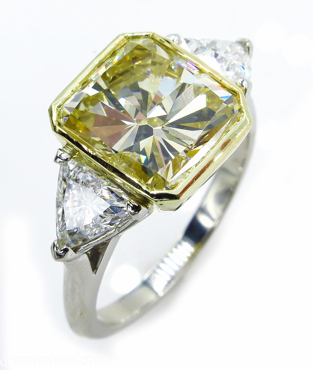 A Breathtaking Estate HANDMADE PLATINUM (tested) Radiant Diamond Three-Stone Engagement ring. The Bezel Set Radiant Diamond is 5.06CT with measurements of 10.50x9.50x6.52mm. EGL USA Certified as Natural Very Light to Light Yellow color and SI3