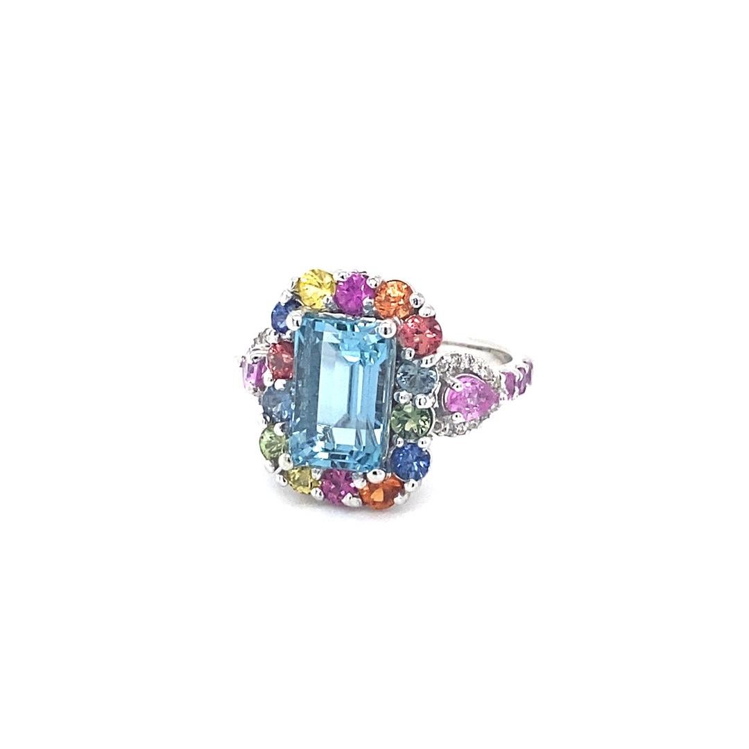 6.07 Carat Aquamarine Multi Sapphire Diamond White Gold Cocktail Ring

This ring has a gorgeous 3.60 Carat Emerald Cut Aquamarine and is surrounded by 20 Multi-Colored Sapphires that weigh 1.92 carats and 2 Pear Cut Pink Sapphires that weigh 0.43