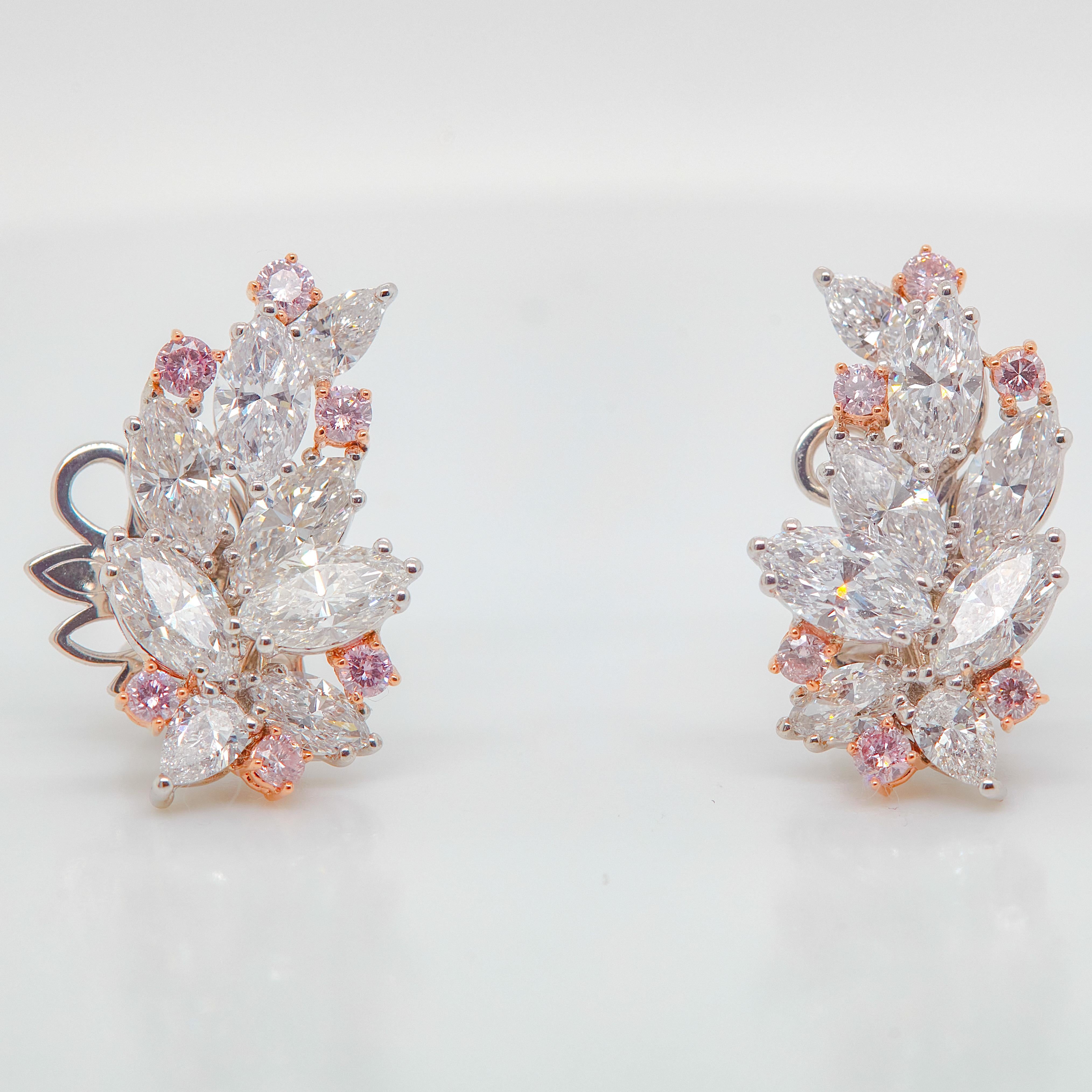 Absolutely gorgeous 6.07 carat Cluster Pink Diamond and Diamond Earrings with colorful accents, these Pink and White Diamond earrings offer a vibrant take on a classic jewel.
12 Pink diamonds weighing a total of approximately 0.55 carats with 12