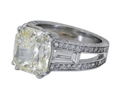6.07 Carat Radiant Cut Yellow Diamond Three-Stone Engagement Ring