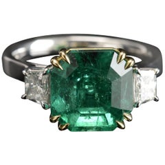 6.08 Carat Colombian Emerald Cut Emerald and Diamond Three-Stone Ring