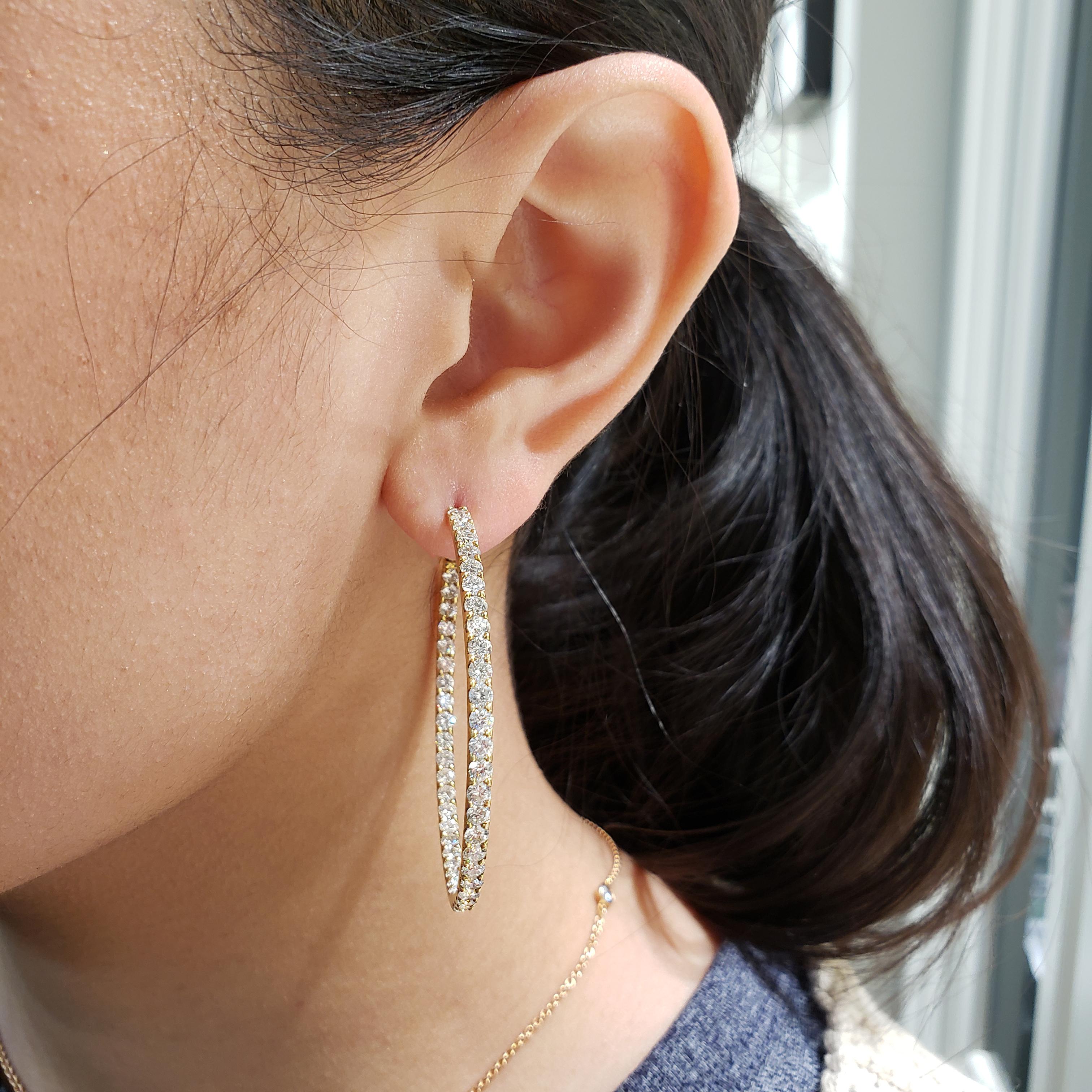 A classic style hoop earrings showcasing a row of round brilliant diamonds weighing 6.08 carats total, set inside and out in a pave setting, Made in 18K Yellow Gold

Style available in different price ranges. Prices are based on your selection.