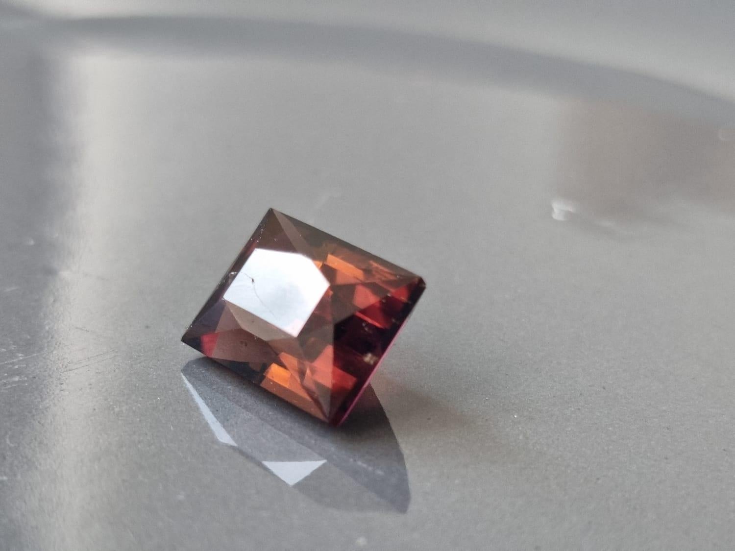 Unearth the natural beauty of this 6.08-carat Square Cut Tourmaline, a unique and enchanting gemstone now available exclusively on this Marketplace. With its captivating pink and earth tones, square-cut elegance, this gem promises to be the focal