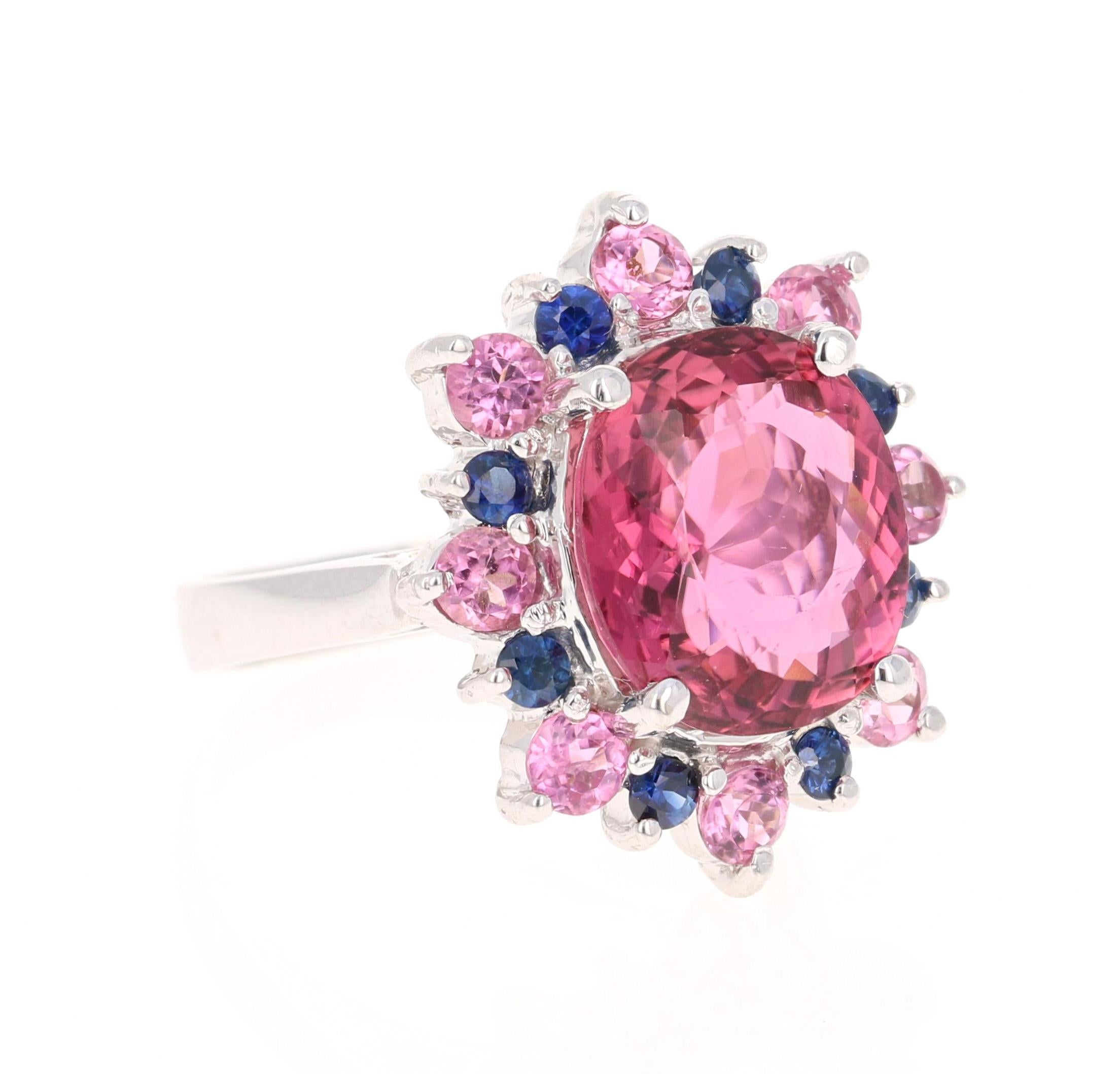 Stunning and uniquely designed 7.82 Carat Pink Tourmaline and Diamond Yellow Gold Cocktail Ring! 

This ring has a 4.83 Carat Oval Cut Pink Tourmaline and is surrounded by 8 Round Cut Pink Tourmalines that weigh 0.86 Carats along with 8 Blue
