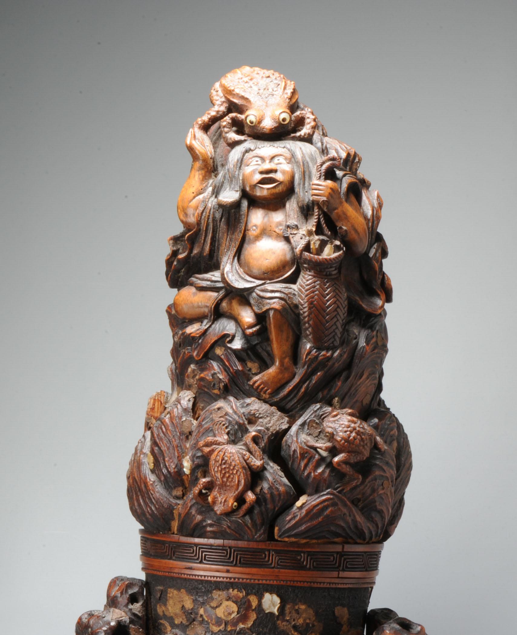 This is the most unusually made antique Kobako / Okimono we have had

It shows Liu Hai the Alchemist with Chan Chu, the tree-legged toad who taught him the secret of immortality. It has a small panel inside with a mark.

Condition
Chips, frits,