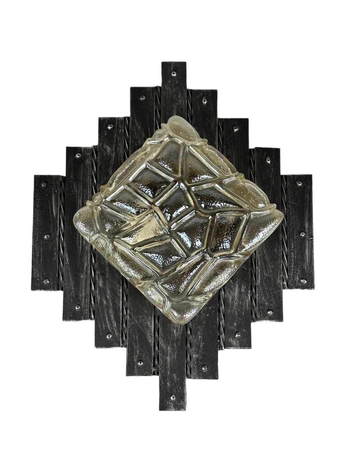 60's 70's Brutalist Wall Lamp Iron & Glass Wall Sconce

Object: wall lamp

Manufacturer:

Condition: good - vintage

Age: around 1960-1970

Dimensions:

Height= 48cm
Width = 38.5cm
Depth = 12cm

Other notes:

E27 socket

The pictures serve as part