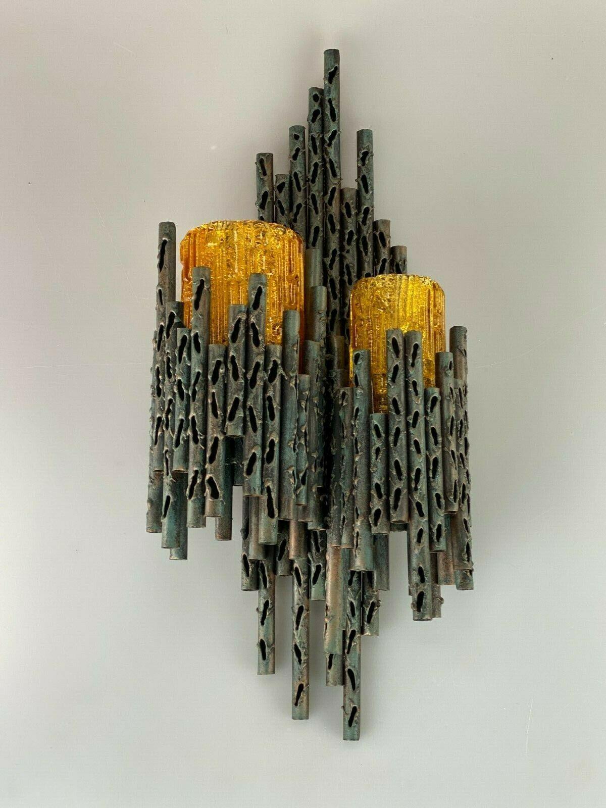 60s 70s Brutalist wall lamp Marcello Fantoni wall lamp glass design 60s

Object: wall lamp

Manufacturer: Marcello Fantoni

Condition: good

Age: around 1960-1970

Dimensions:

26cm x 59cm x 15cm

Other notes:

The pictures serve as