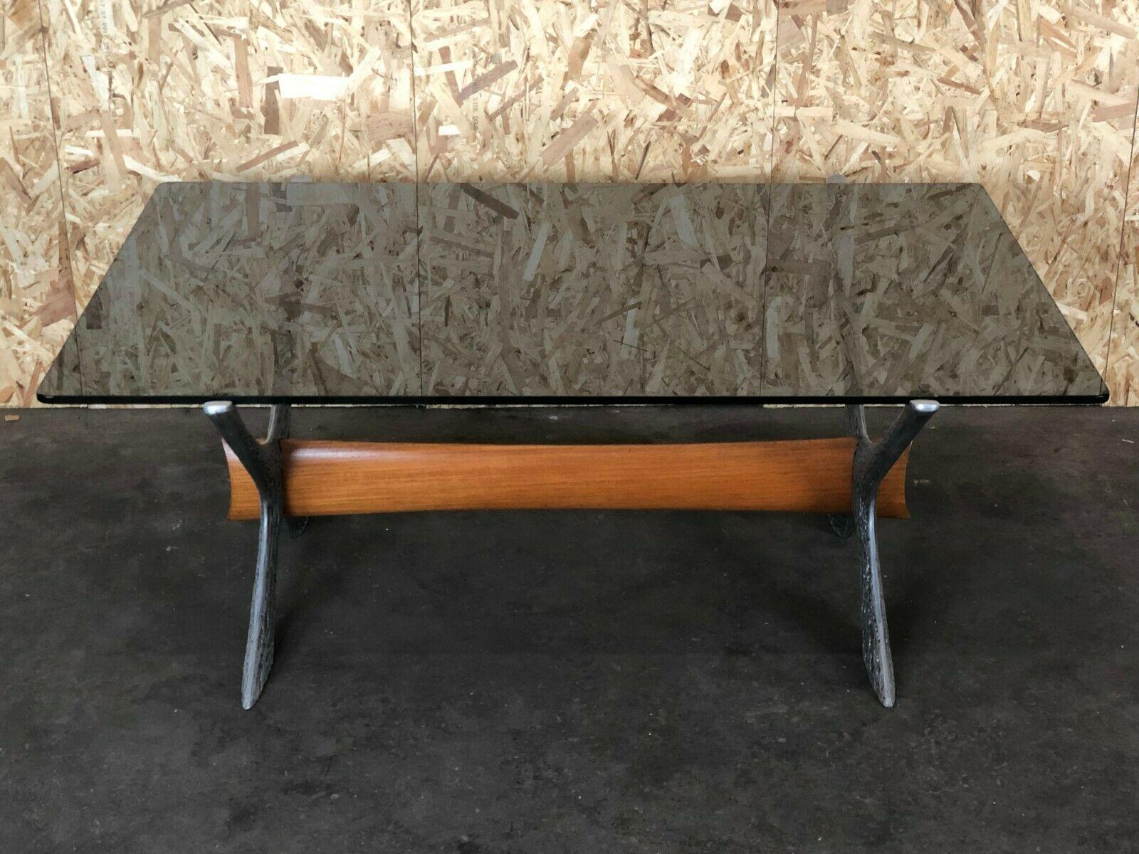 60s 70s Coffee table coffee table glass top metal teak 60s 70s.

Object: coffee table

Manufacturer:

Condition: good

Age: around 1960-1970

Dimensions:

135cm x 94cm x 52cm

Other notes:

The pictures serve as part of the