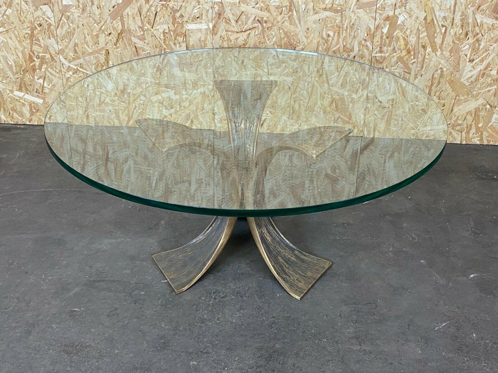 60s 70s coffee table Luciano Frigerio brutalist bronze glass table 60s

Object: coffee table

Manufacturer: Luciano Frigerio

Condition: good

Age: around 1960-1970

Dimensions:

Diameter = 110cm
Height = 47cm

Other notes:

The