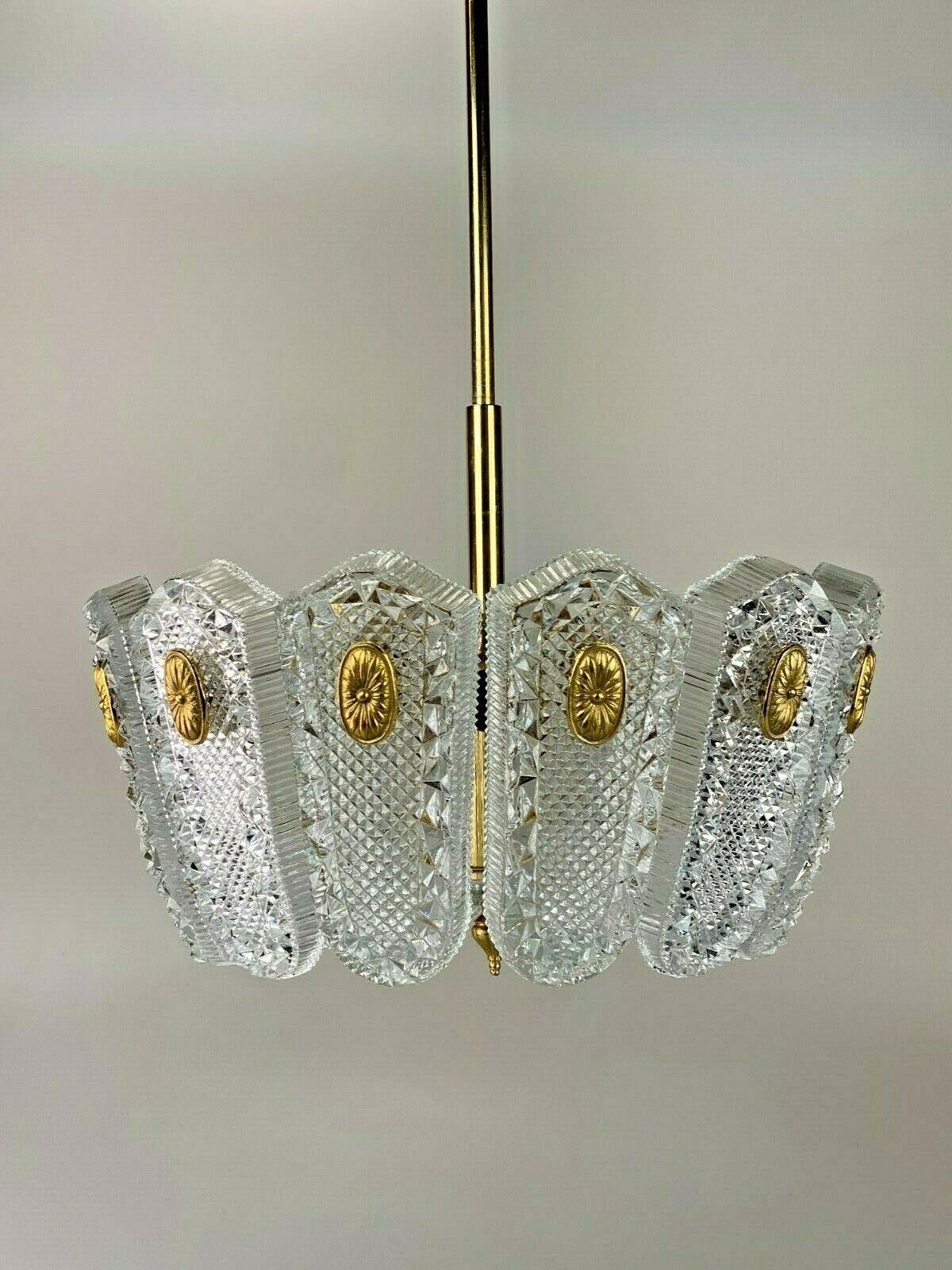 60s 70s Lamp light ceiling lamp chandelier chandelier Orrefors 60s.

Object: chandelier

Manufacturer: Orrefors

Condition: good

Age: around 1960-1970

Dimensions:

Diameter = 43cm
Height = 64cm

Other notes:

The pictures serve as
