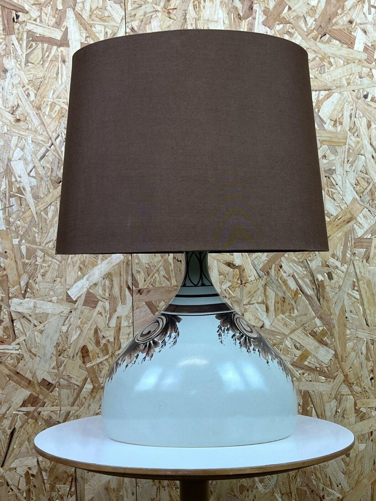 60s 70s lamp light table lamp ceramic Bjorn Wiinblad Rosenthal design

Object: table lamp

Manufacturer: Rosenthal

Condition: good

Age: around 1960-1970

Dimensions:

Diameter = 38cm
Height = 52cm

Other notes:

The pictures serve