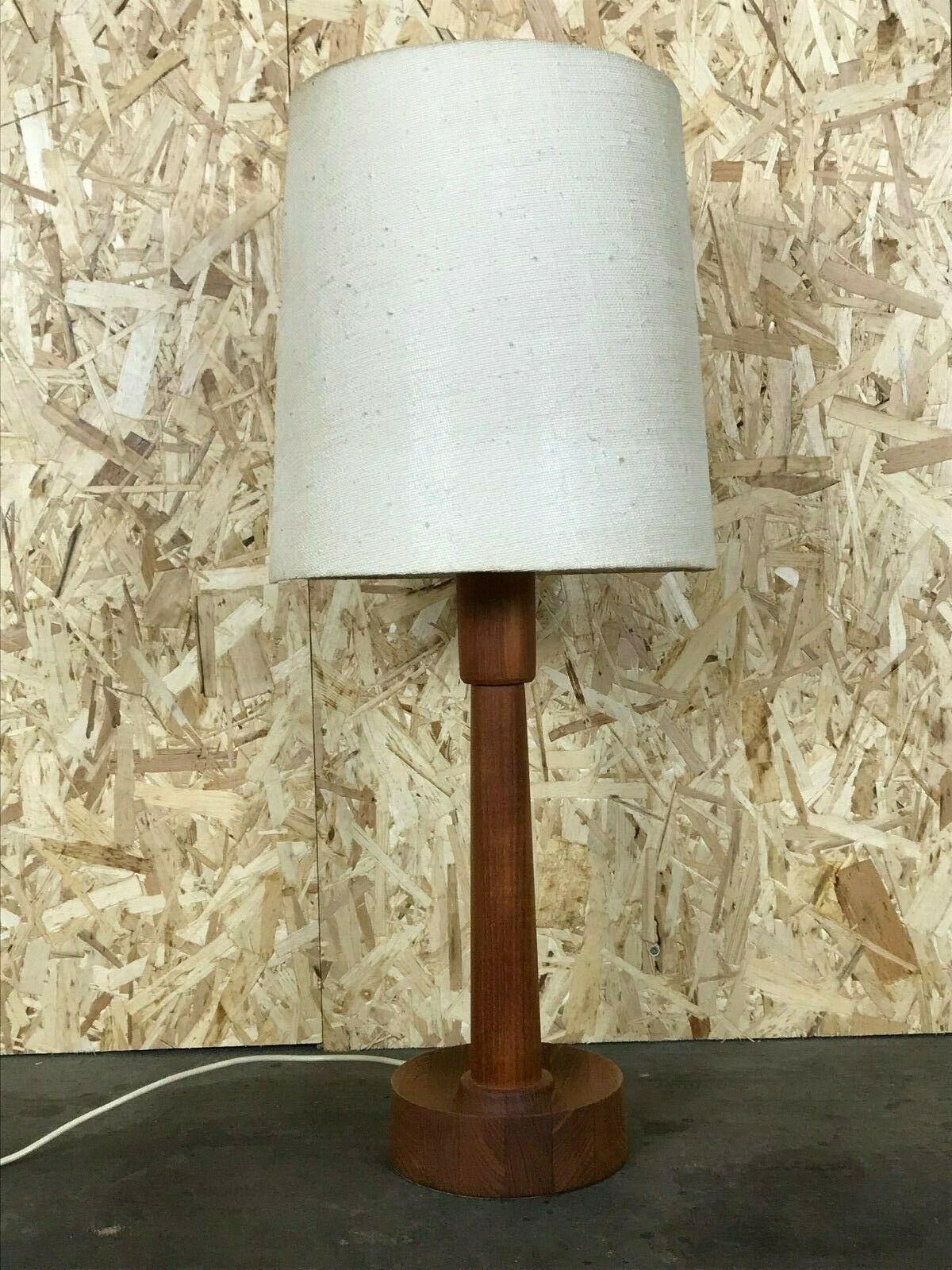 60s 70s lamp light table lamp teak space age Danish design 60s 70s

Object: table lamp

Manufacturer:

Condition: good

Age: around 1960-1970

Dimensions:

Height = 84cm
Diameter = 36cm

Other notes:

The pictures serve as part of