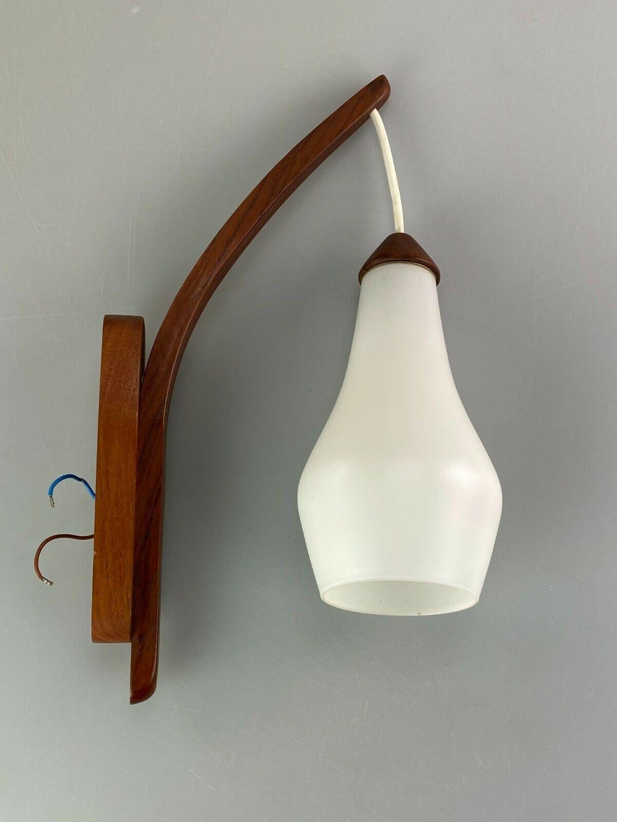 60s 70s lamp teak light wall lamp Uno & Östen Kristiansson Luxus 60s

Object: wall lamp

Manufacturer: Luxury

Condition: good

Age: around 1960-1970

Dimensions:

22cm x 11cm x 38cm

Other notes:

The pictures serve as part of the