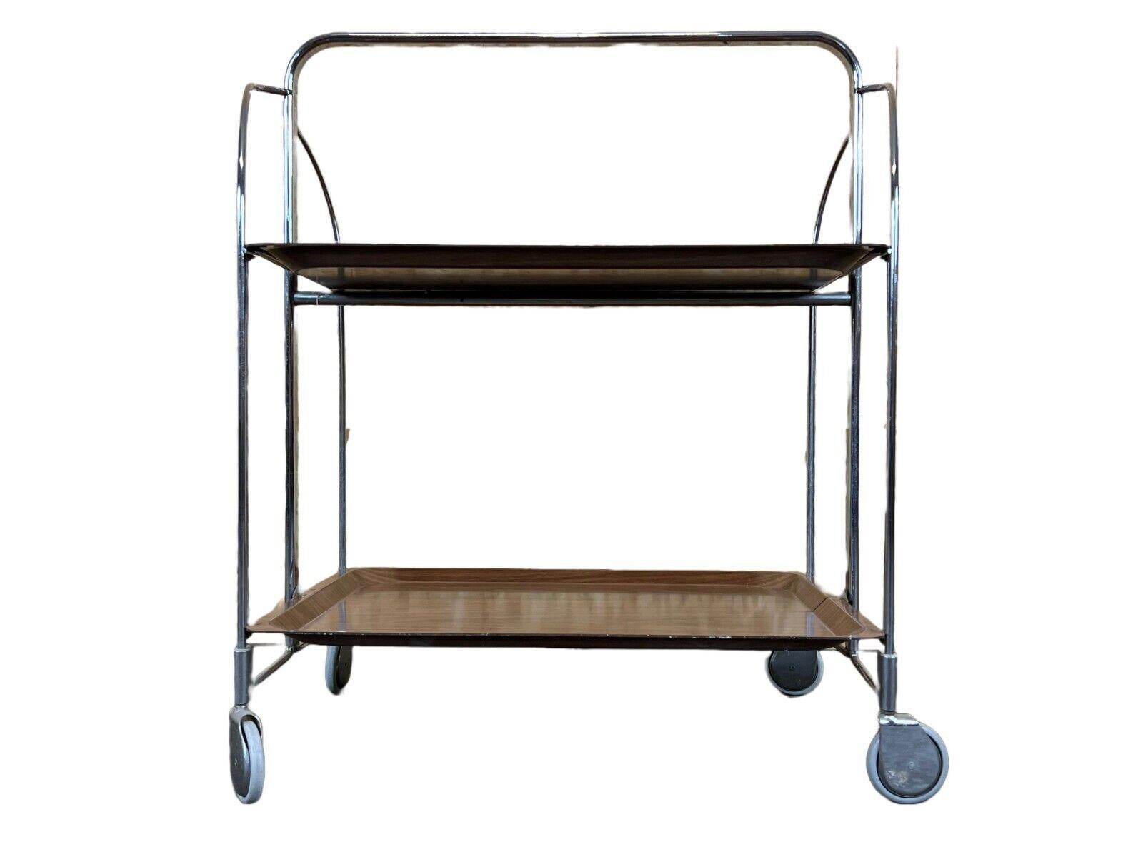 60s 70s serving trolley dinett side table Space Age Brown Design 60s 70s

Object: Serving trolley

Manufacturer:

Condition: good

Age: around 1960-1970

Dimensions:

Width = 68.5cm
Depth = 41.5cm
Height = 78.5cm

Other notes:

The