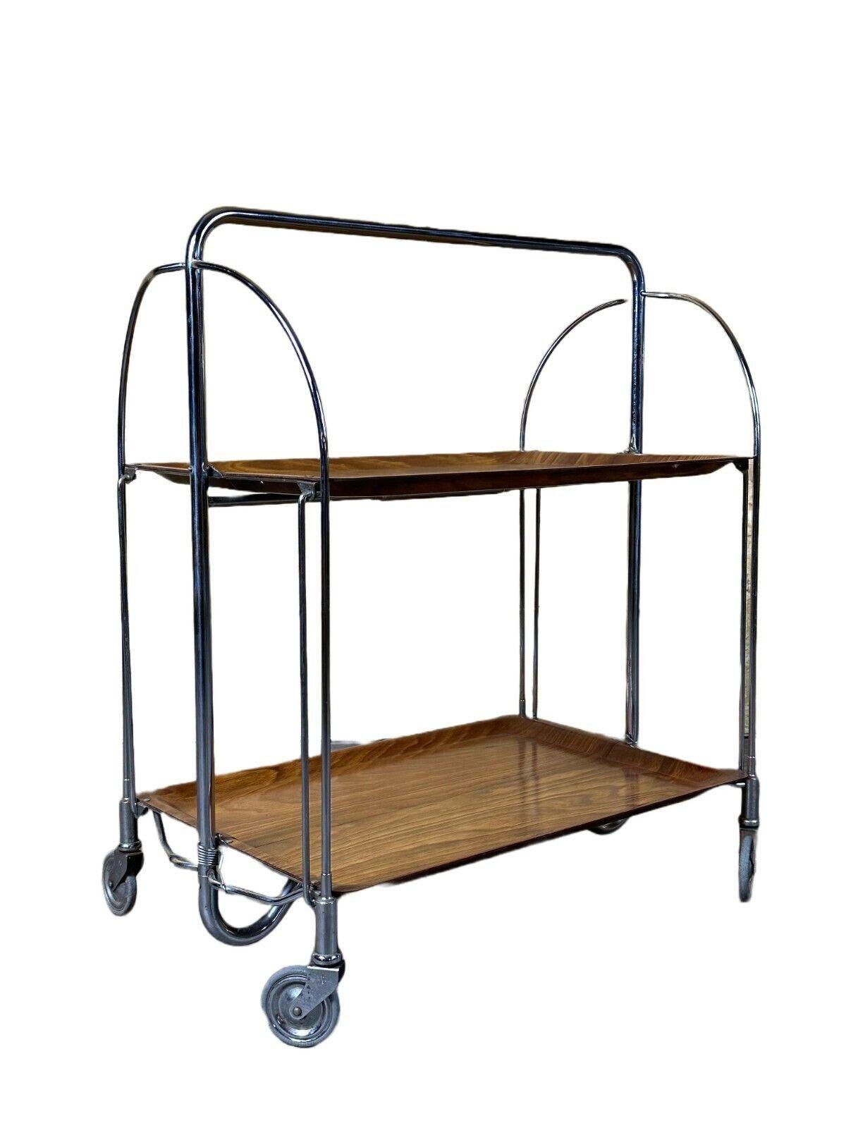 60s 70s serving trolley dinette side table space age brown design 60s 70s

Object: serving trolley

Manufacturer:

Condition: good

Age: around 1960-1970

Dimensions:

Width = 63.5cm
Depth = 41.5cm
Height = 77.5cm

Material: metal, plastic

Other