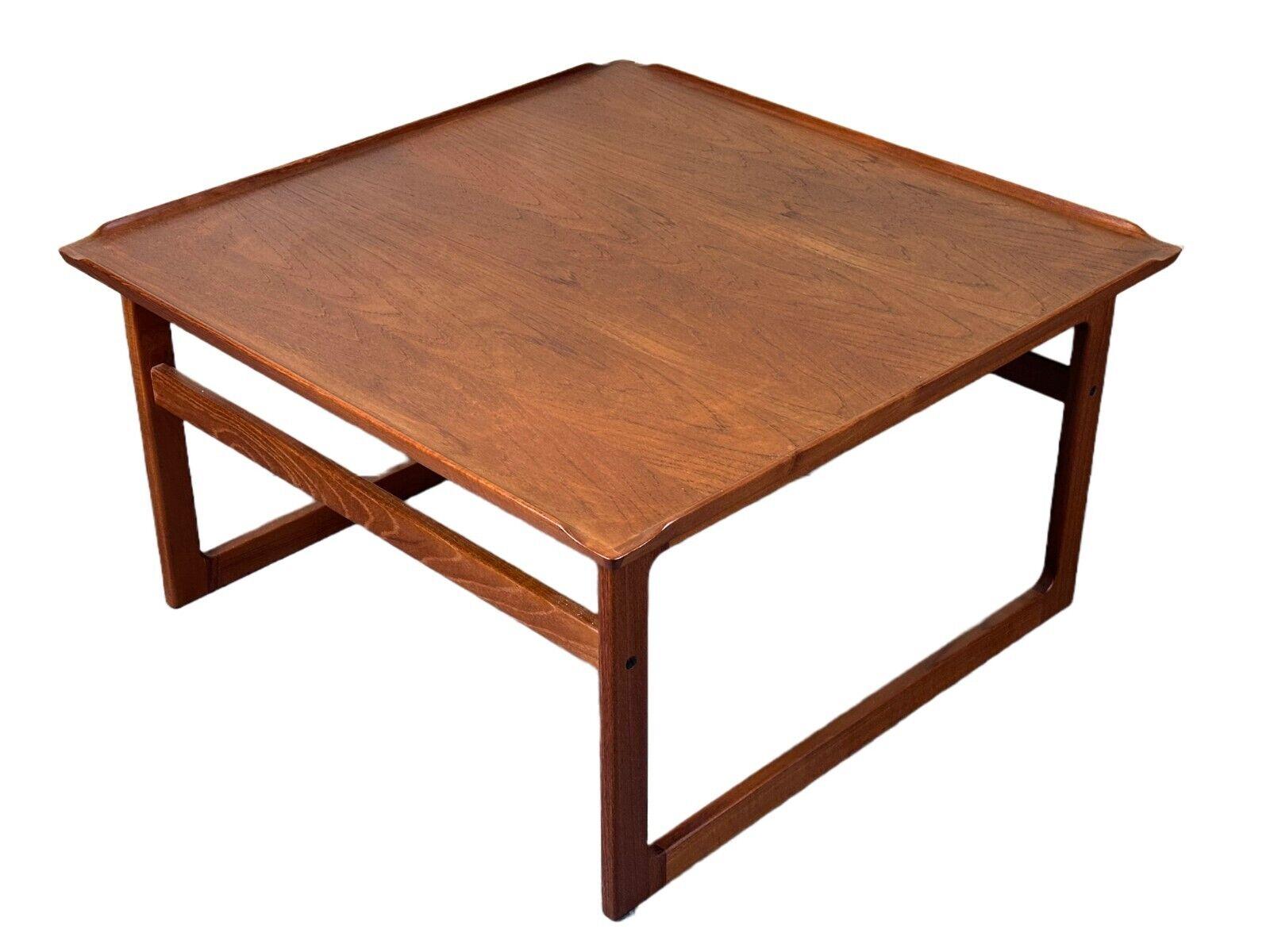 60s 70s teak coffee table Kubus by Jalk Vodder Andersen for Dyrlund Denmark

Object: coffee table

Manufacturer: Dyrlund

Condition: good - vintage

Age: around 1960-1970

Dimensions:

80cm x 80cm x 44.5cm

Material: teak

Other notes:

The pictures