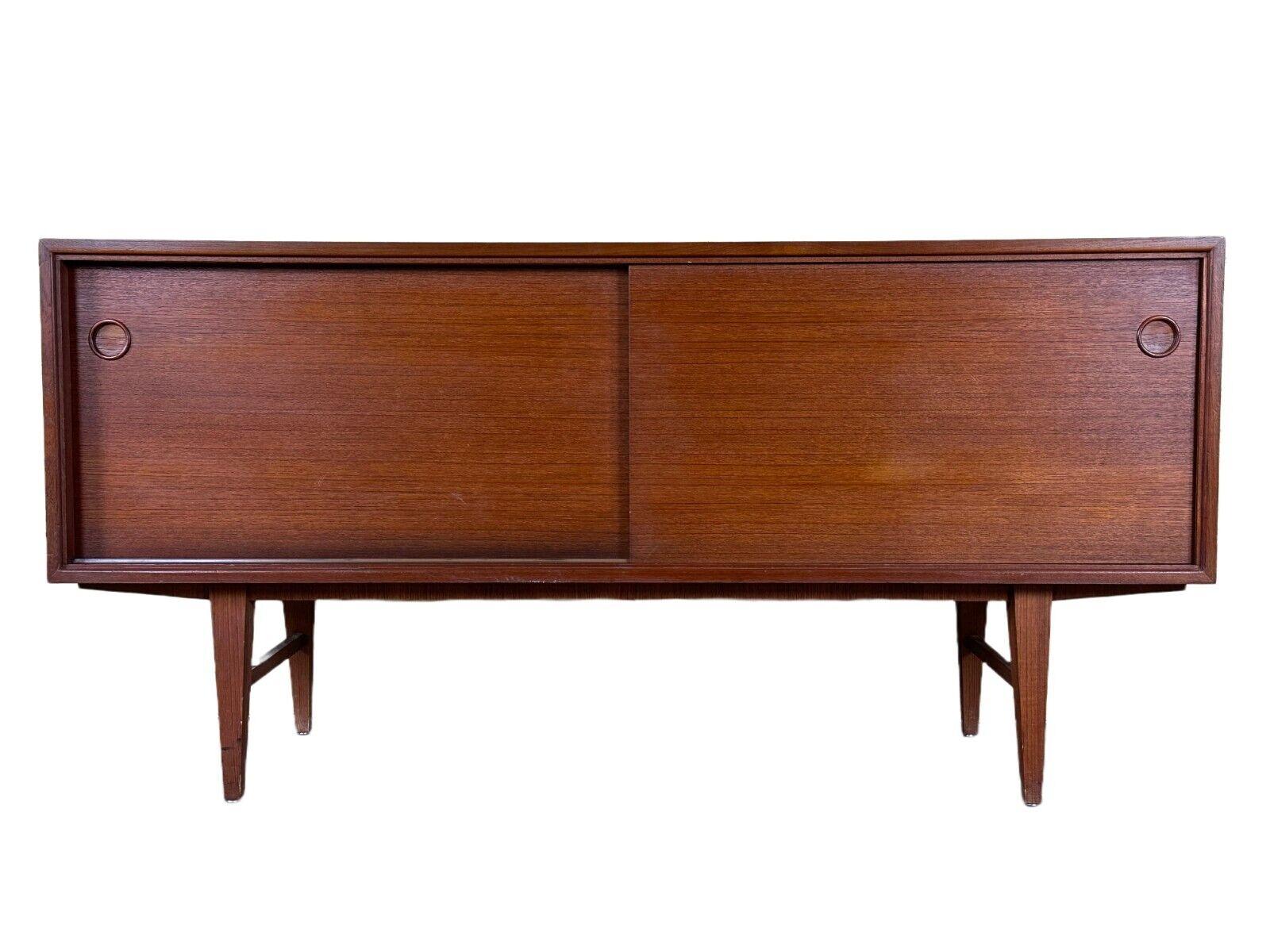 60s 70s teak sideboard Credenza cabinet Danish Modern Design Denmark 70s

Object: sideboard

Manufacturer:

Condition: good

Age: around 1960-1970

Dimensions:

Width = 153cm
Depth = 47cm
Height = 75cm

Other notes:

The pictures serve as part of