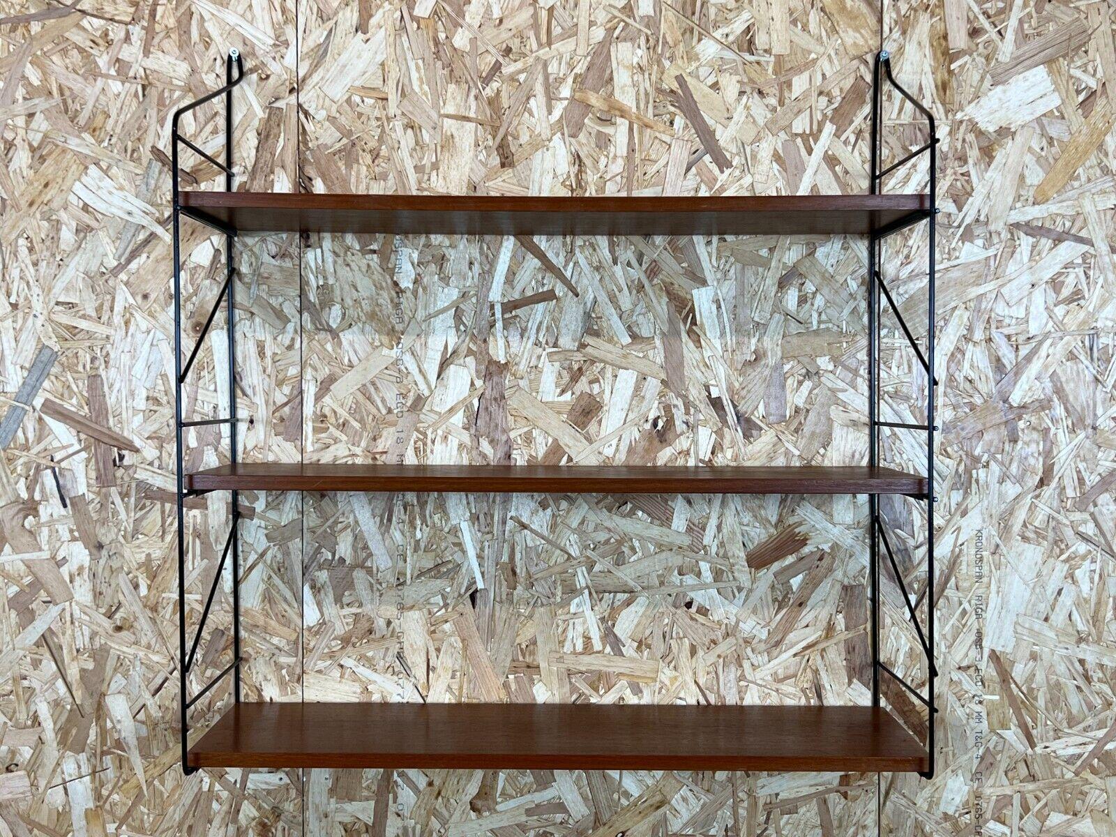 60s 70s teak string shelf wall shelf String shelf Danish Design Denmark

Object: wall shelf

Manufacturer:

Condition: good

Age: around 1960-1970

Dimensions:

70cm x 23cm x 72.5cm

Other notes:

The pictures serve as part of the