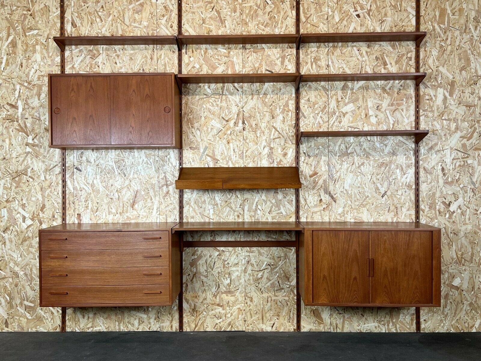 60s 70s teak teak shelf wall unit Kai Kristiansen Danish Design 60s

Object: wall unit

Manufacturer: Kai Kristiansen

Condition: good

Age: around 1960-1970

Dimensions:

257.5cm x 46.5cm x 245cm

Other notes:

The pictures serve as