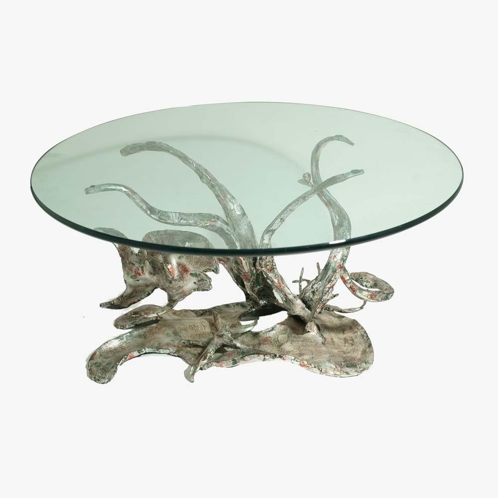 A one of a kind Brutalist , sculptural very organic round occasional table designed and Made in Italy back in the 1970s by Italian sculpture Salvino Marsura.
Hand forged iron base with a silver patina background with camouflage touches shaped as a