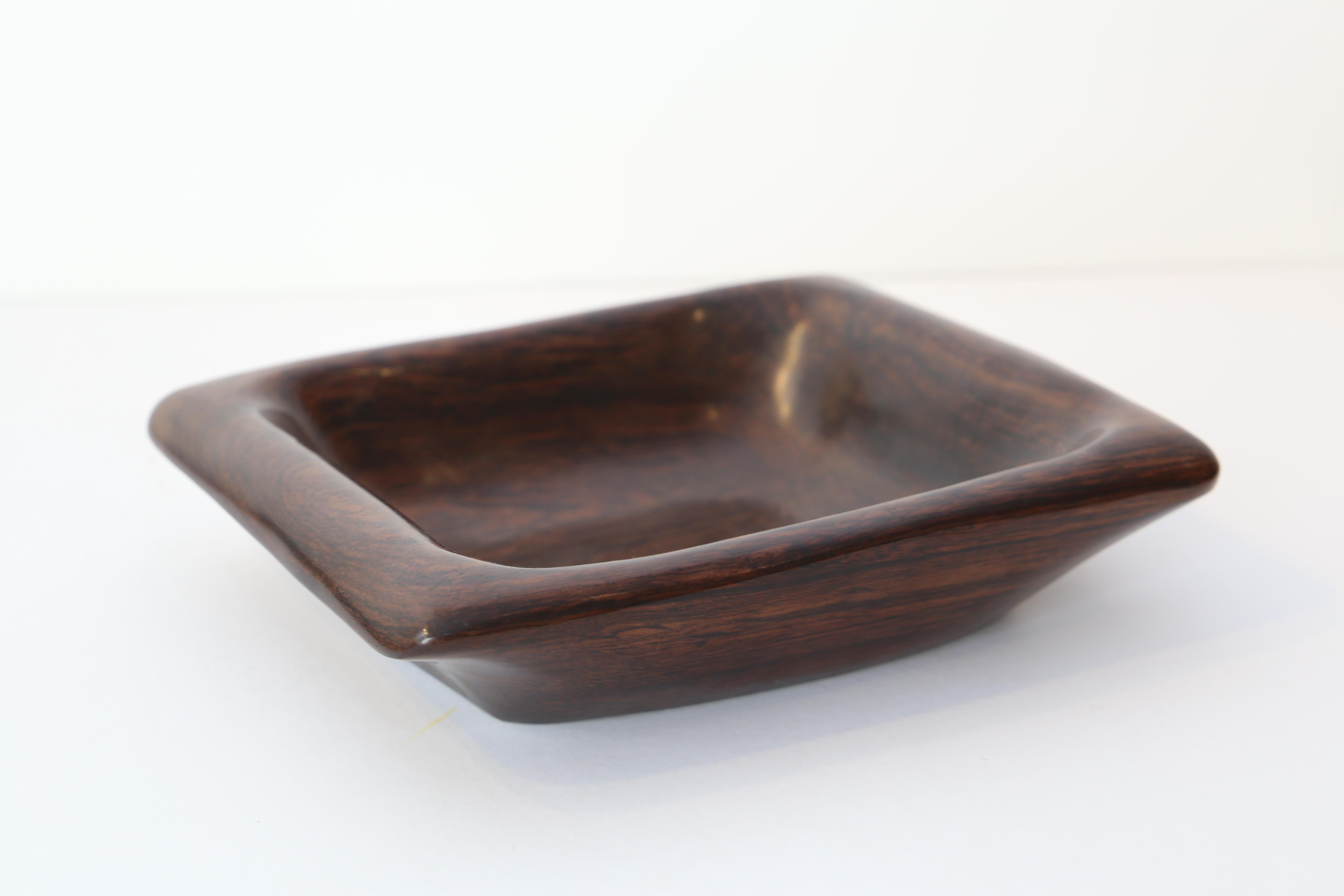 Odile Noll's 'coupe vide-poches' 
1960
Rosewood
6 x 30 x 22 cm
Signed 'ONoll' under the base.