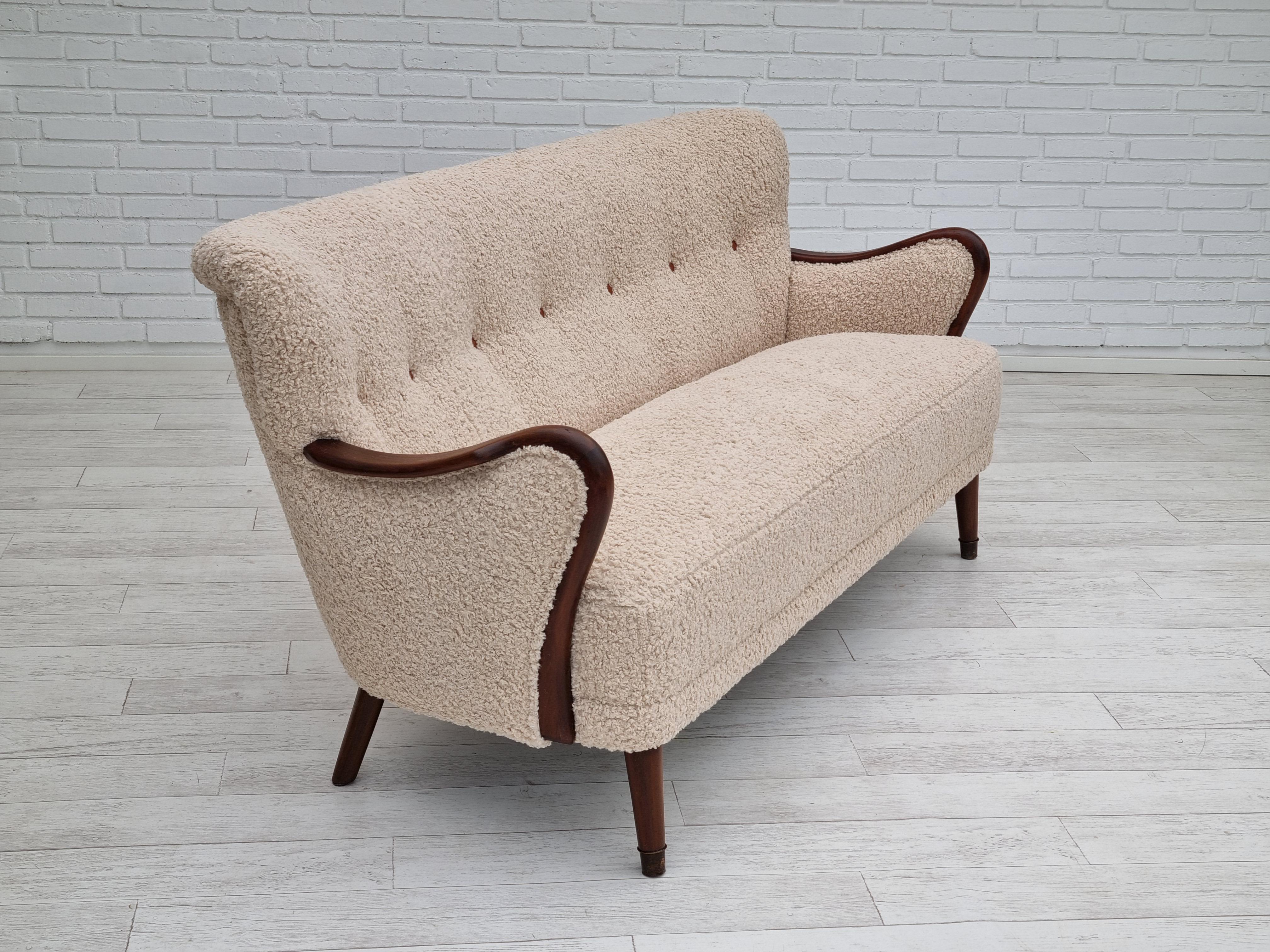 60s, Danish design by Alfred Christensen. Refurbished 3-pers. sofa. Upholstered in quality lambskin imitation. Camel-brown leather buttons. Beech wood legs and armrests. Original brass springs in the seat are kept. Manufactured by Danish furniture