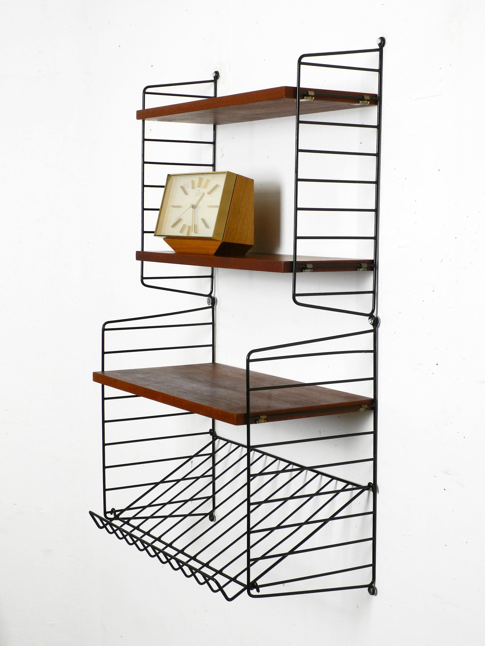 60s dark teak Nisse Strinning wall hanging shelf with 4 shelves + magazine rack In Good Condition In München, DE