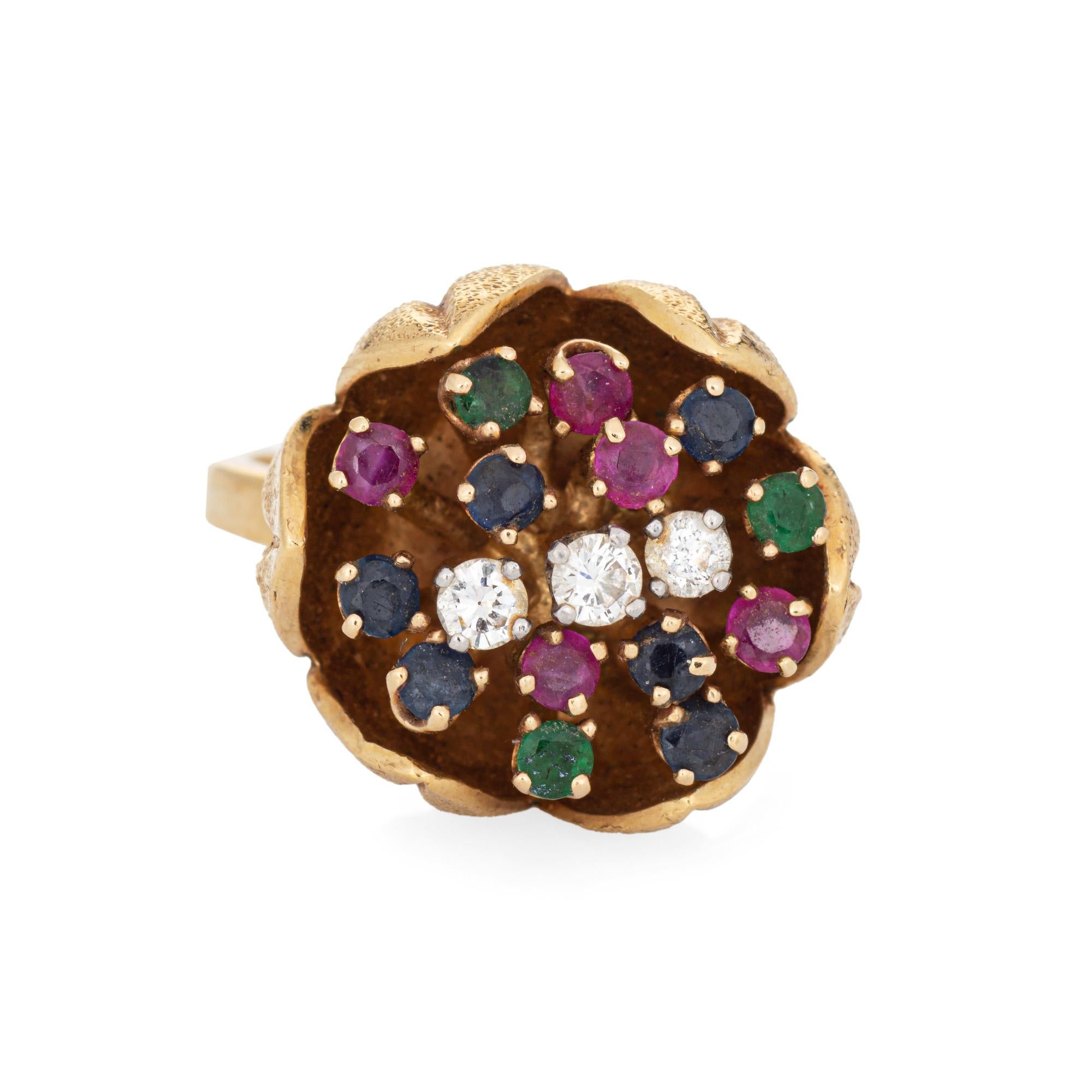 Stylish gemstone & diamond tulip cocktail ring crafted in 18 karat yellow gold (circa 1964). 

Three diamonds total an estimated 0.22 carats (estimated at I-J color and SI1-I2 clarity). Sapphires, emeralds, and rubies measure approx. 2mm each. 