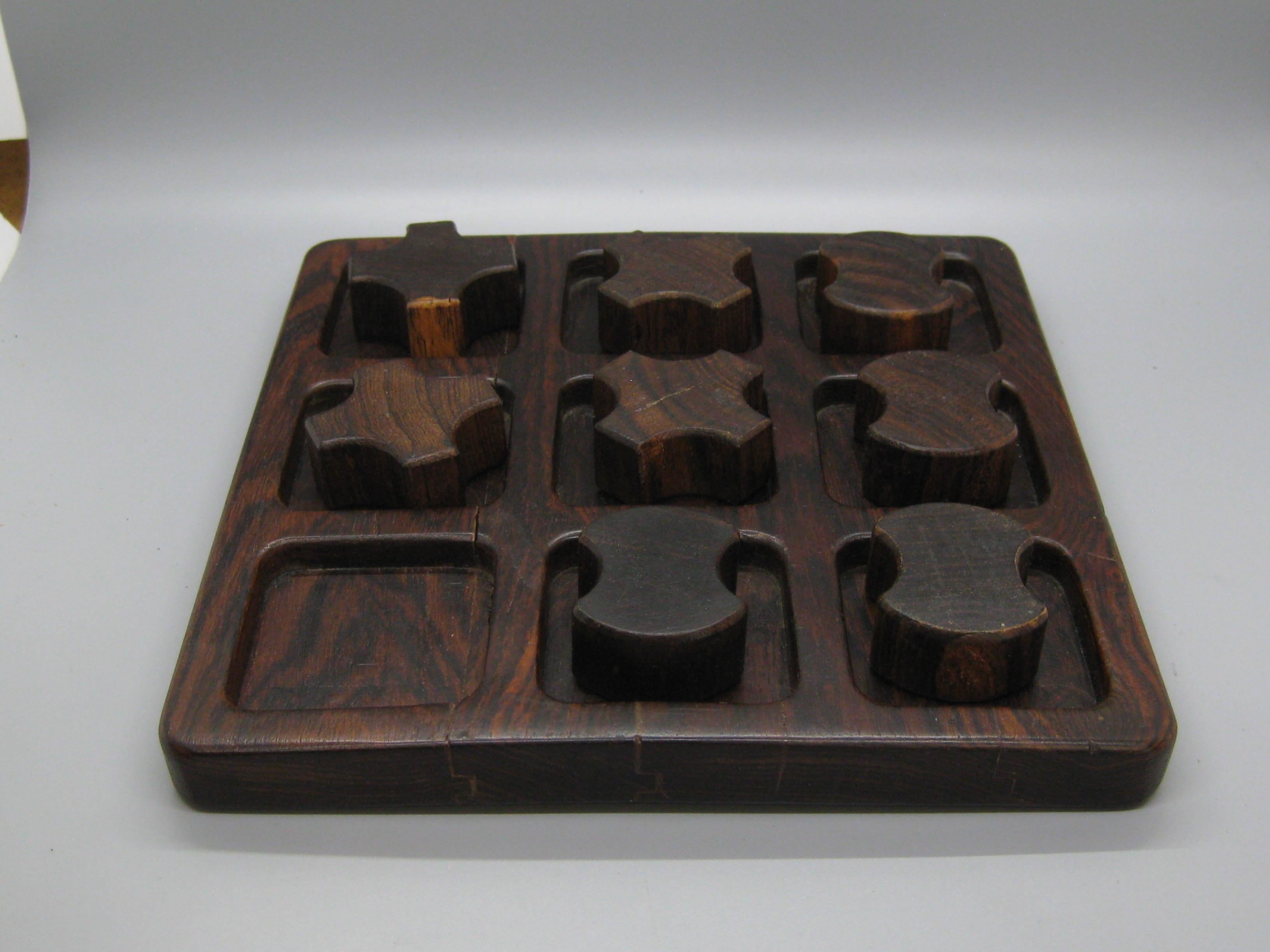 Fantastic hand made Don S. Shoemaker designed tic-tac-toe game for Senal and dates from the 1960's. Made of beautiful rosewood. Has the original artists tag on the bottom. The game is complete and displays well. Wonderful color and grain in the